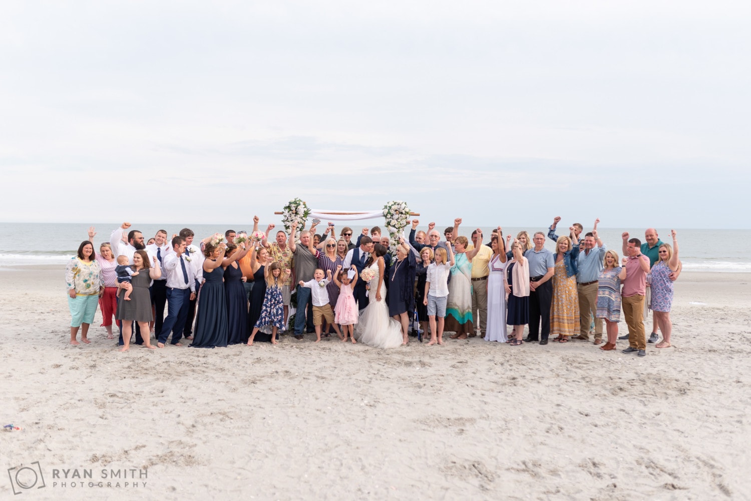 All the wedding guests cheering for bride and groom - Avista Resort - North Myrtle Beach