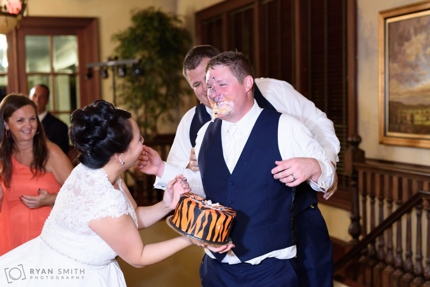 Bride and groom getting wild with the cake smash - Dye Club at Barefoot Resort