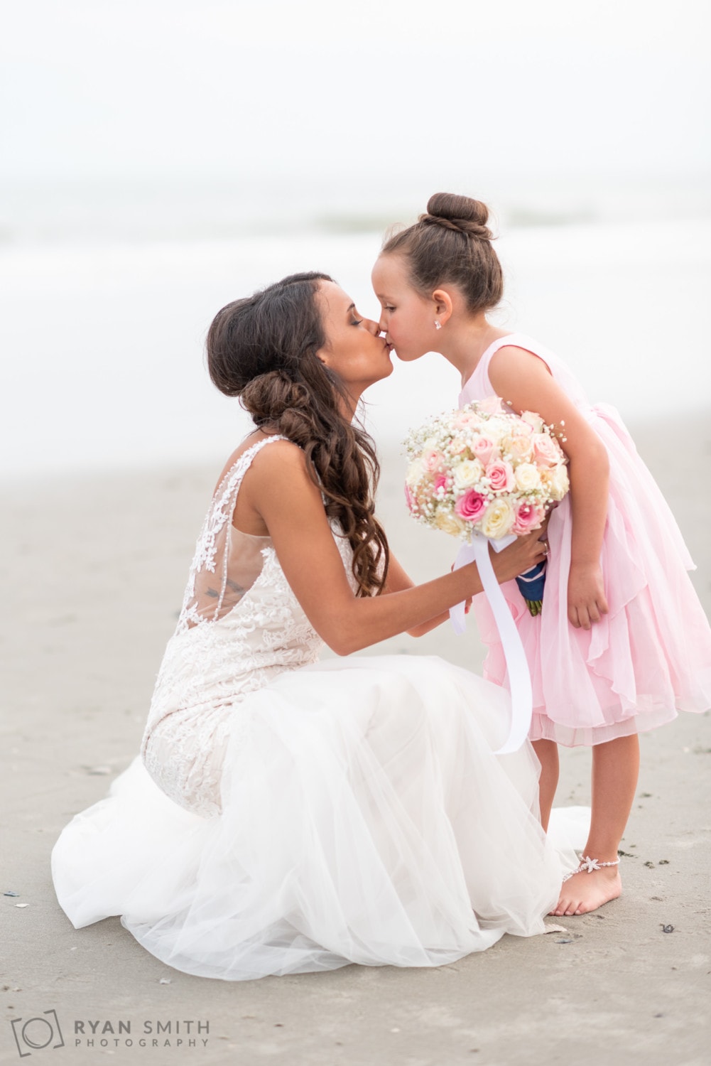 Bride kissing daughter  - Avista Resort - North Myrtle Beach