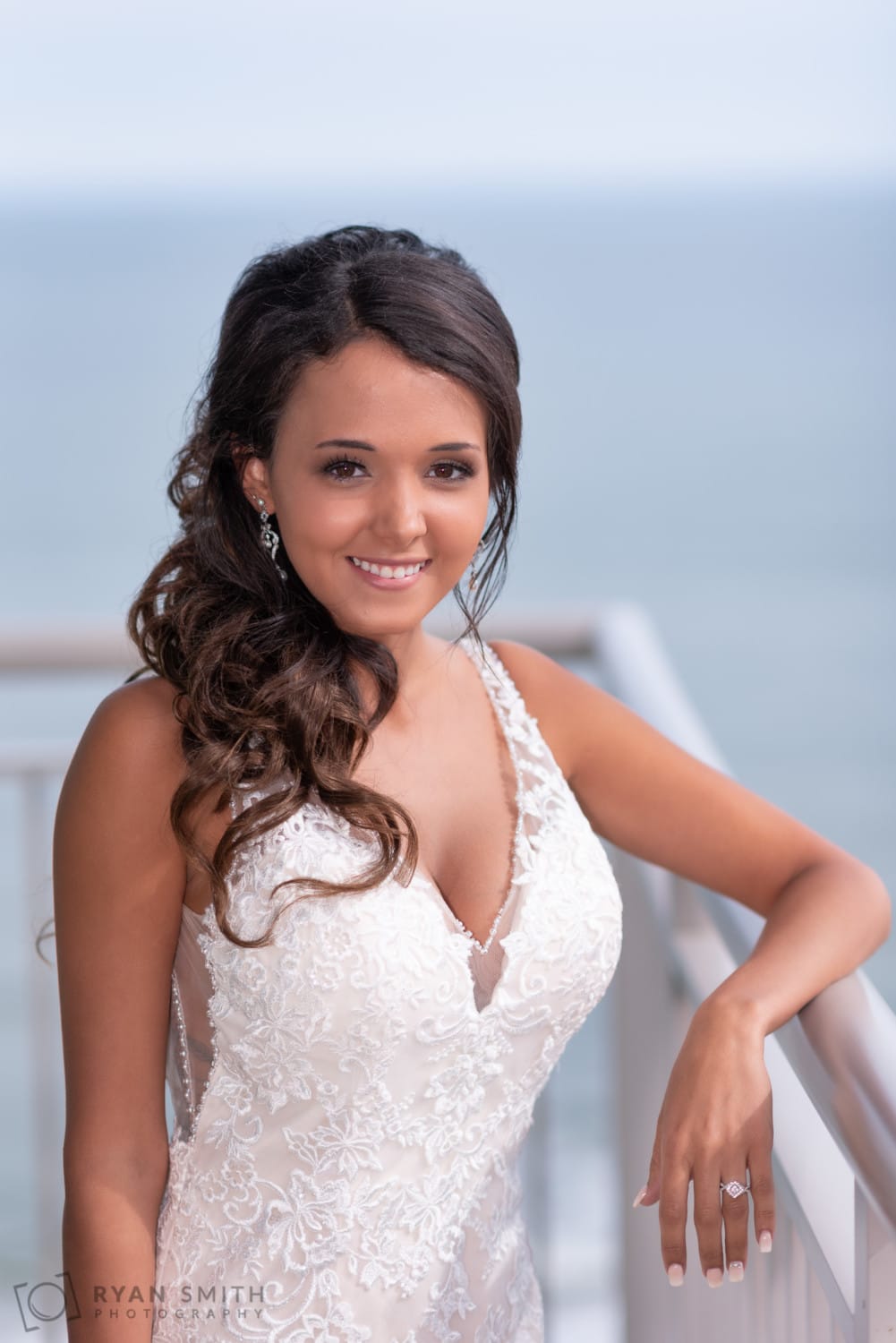 Bride standing on the balcony - Avista Resort - North Myrtle Beach