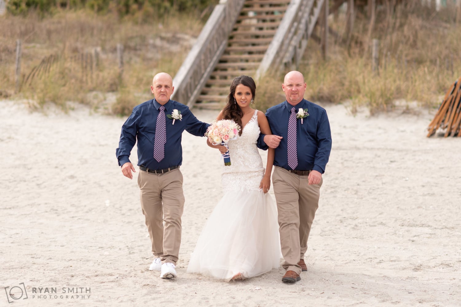 Bride walking towards the ceremony with her father - Avista Resort - North Myrtle Beach