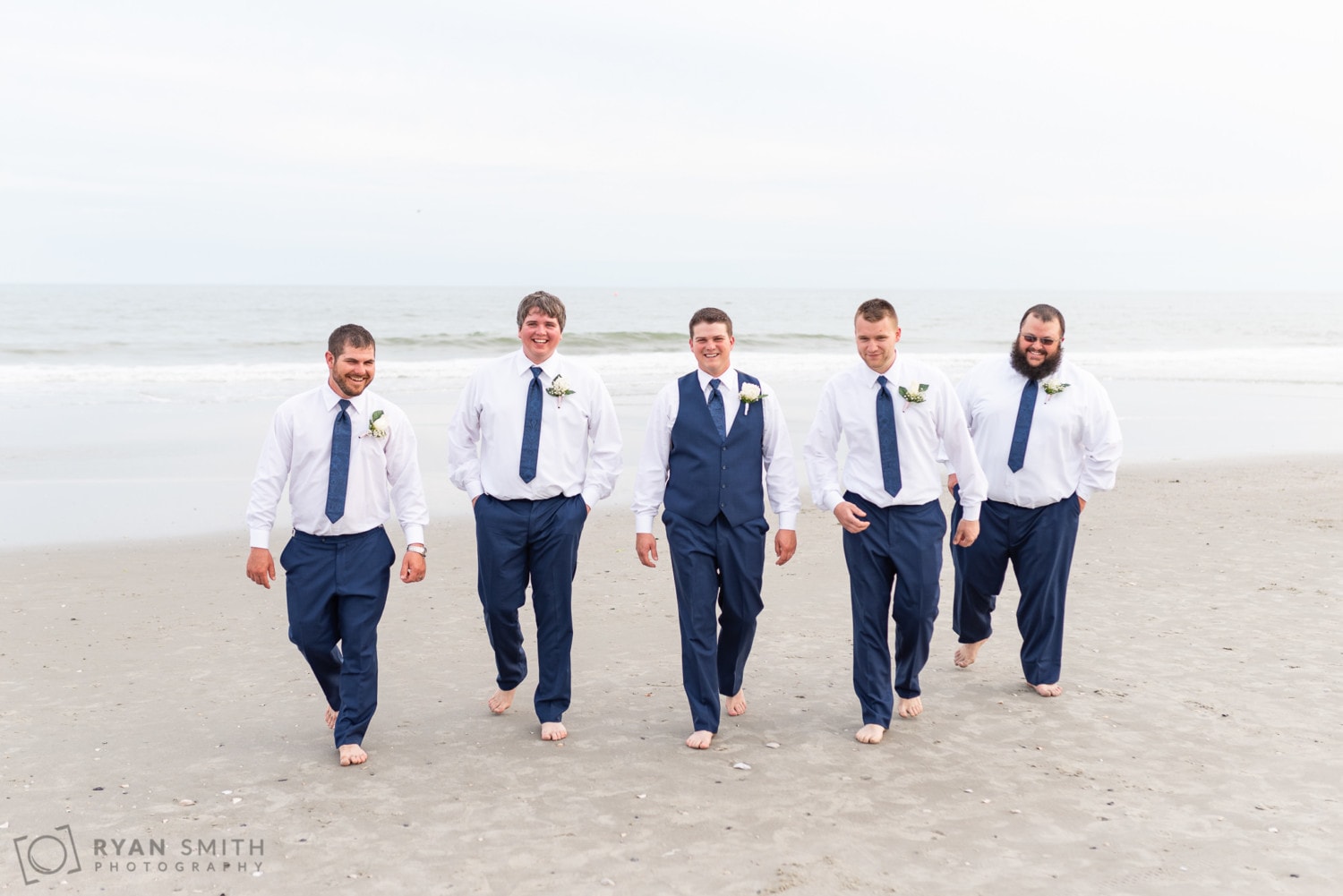 Groomsmen walking down the beach - Avista Resort - North Myrtle Beach