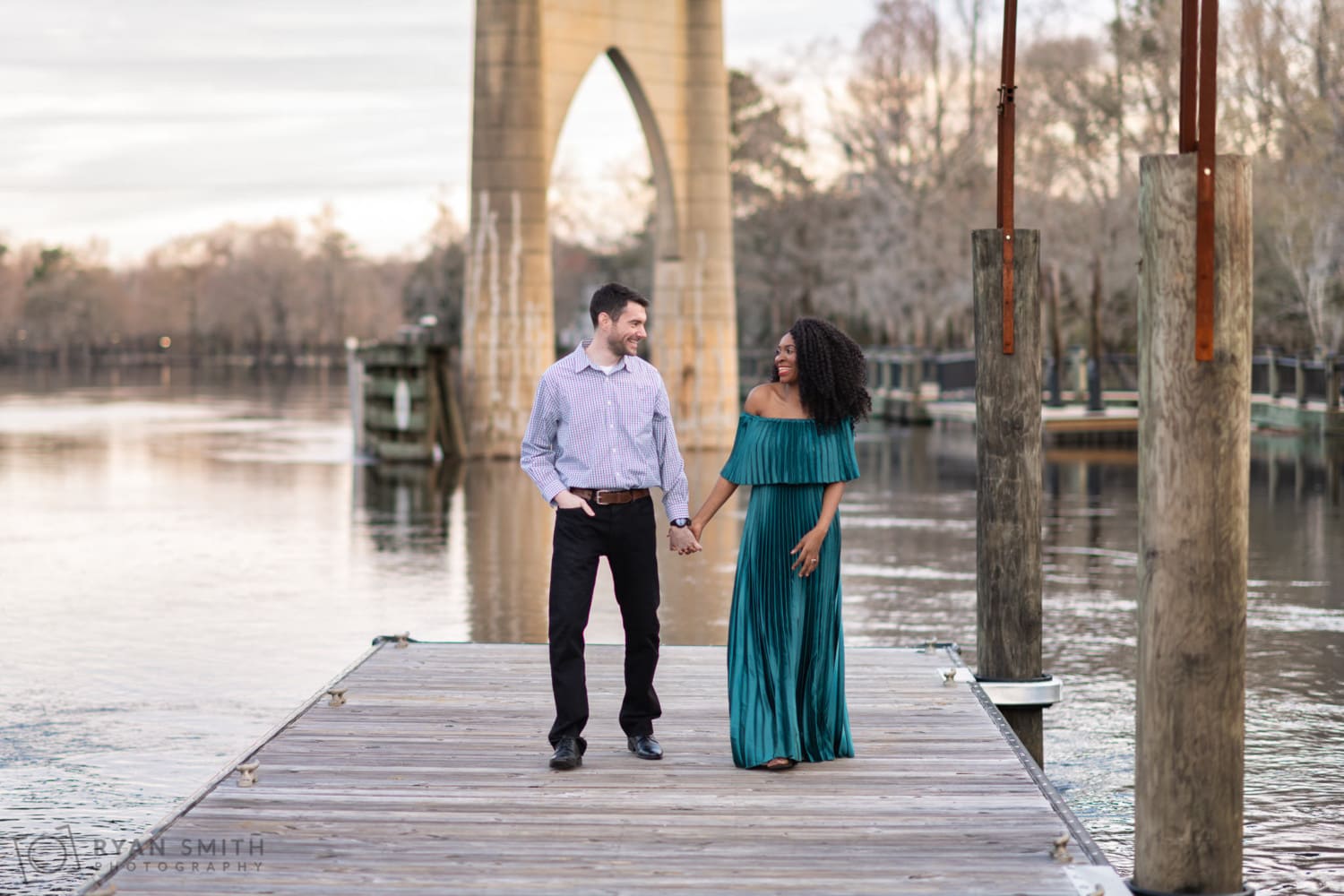 Sunset walk holding hands on the river dock - Conway Riverwalk