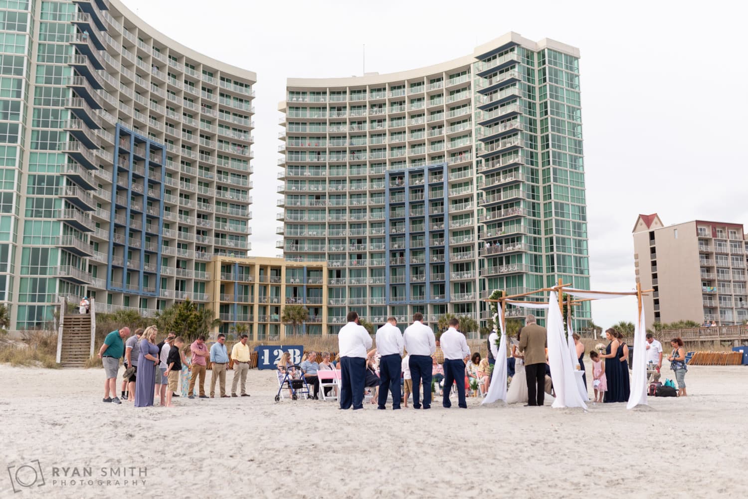 Wedding ceremony with hotel in the background - Avista Resort - North Myrtle Beach