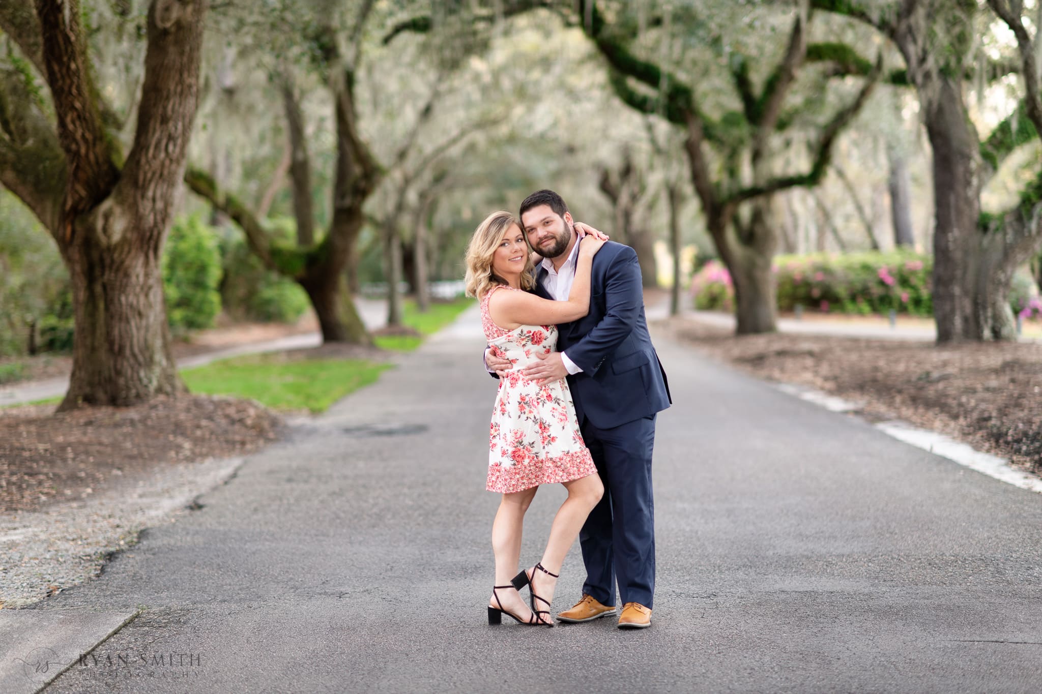 Arms around her fiance under the oaks - Caledonia Golf & Fish Club