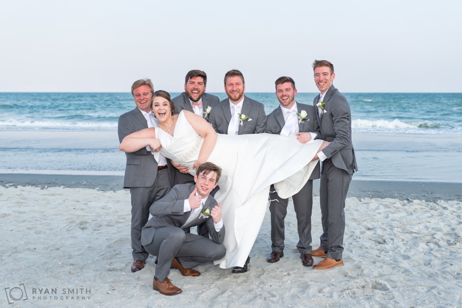 Groomsmen lifting bride into the air - Grande Dunes Ocean Club - Myrtle Beach