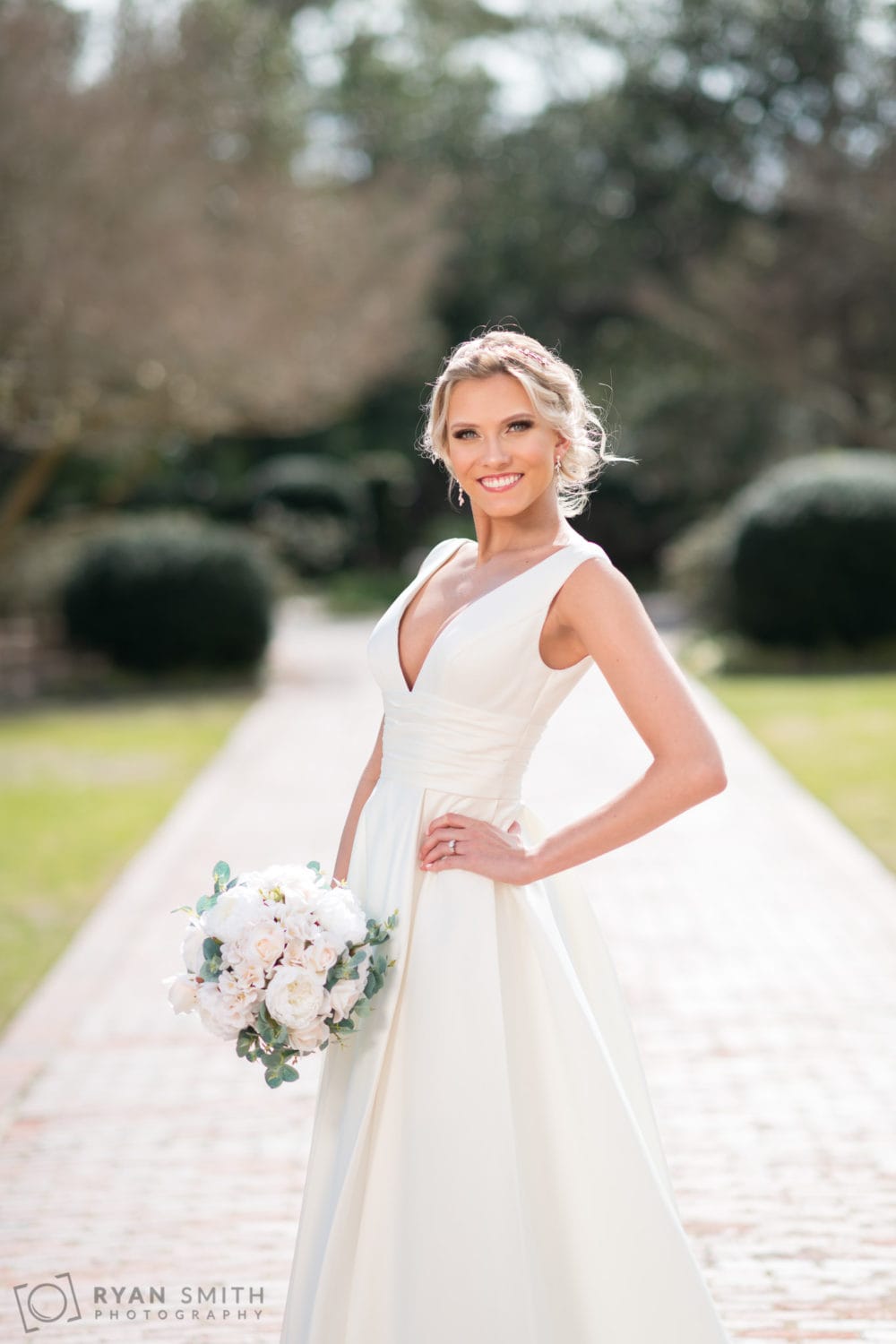 Bridal portraits on the brick walkway behind the clubhouse - Pine Lakes Country Club