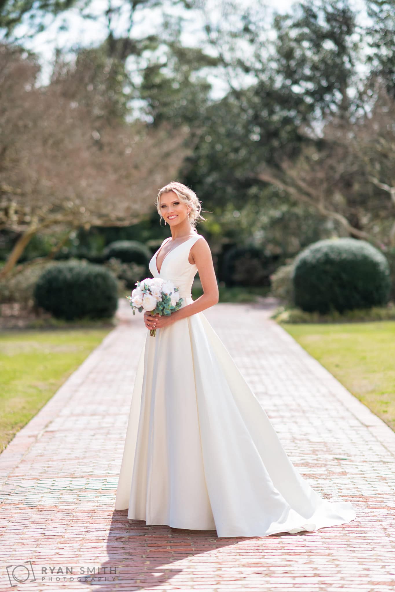 Bridal portraits on the brick walkway behind the clubhouse - Pine Lakes Country Club
