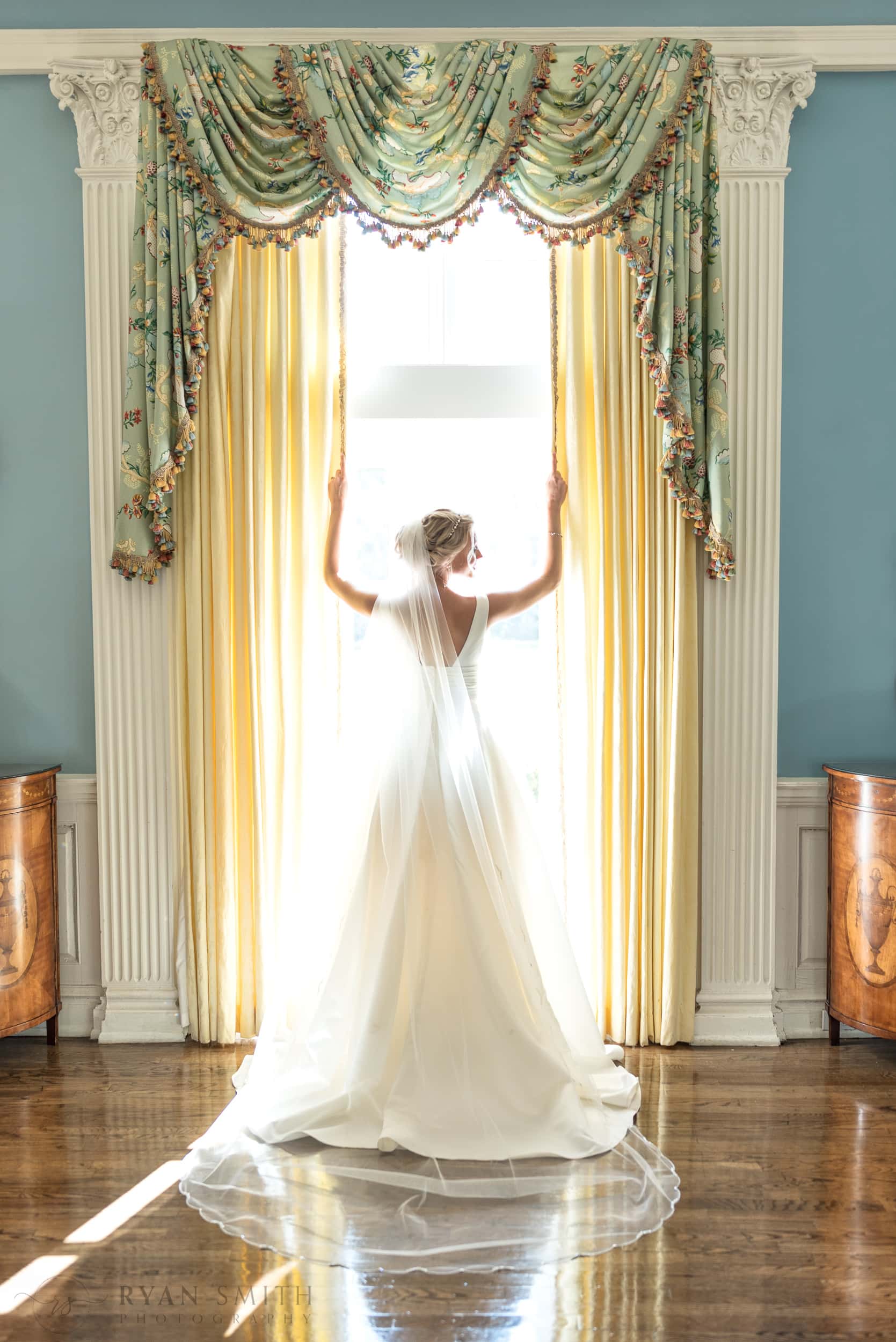 Bride looking out of the ballroom windows - Pine Lakes Country Club
