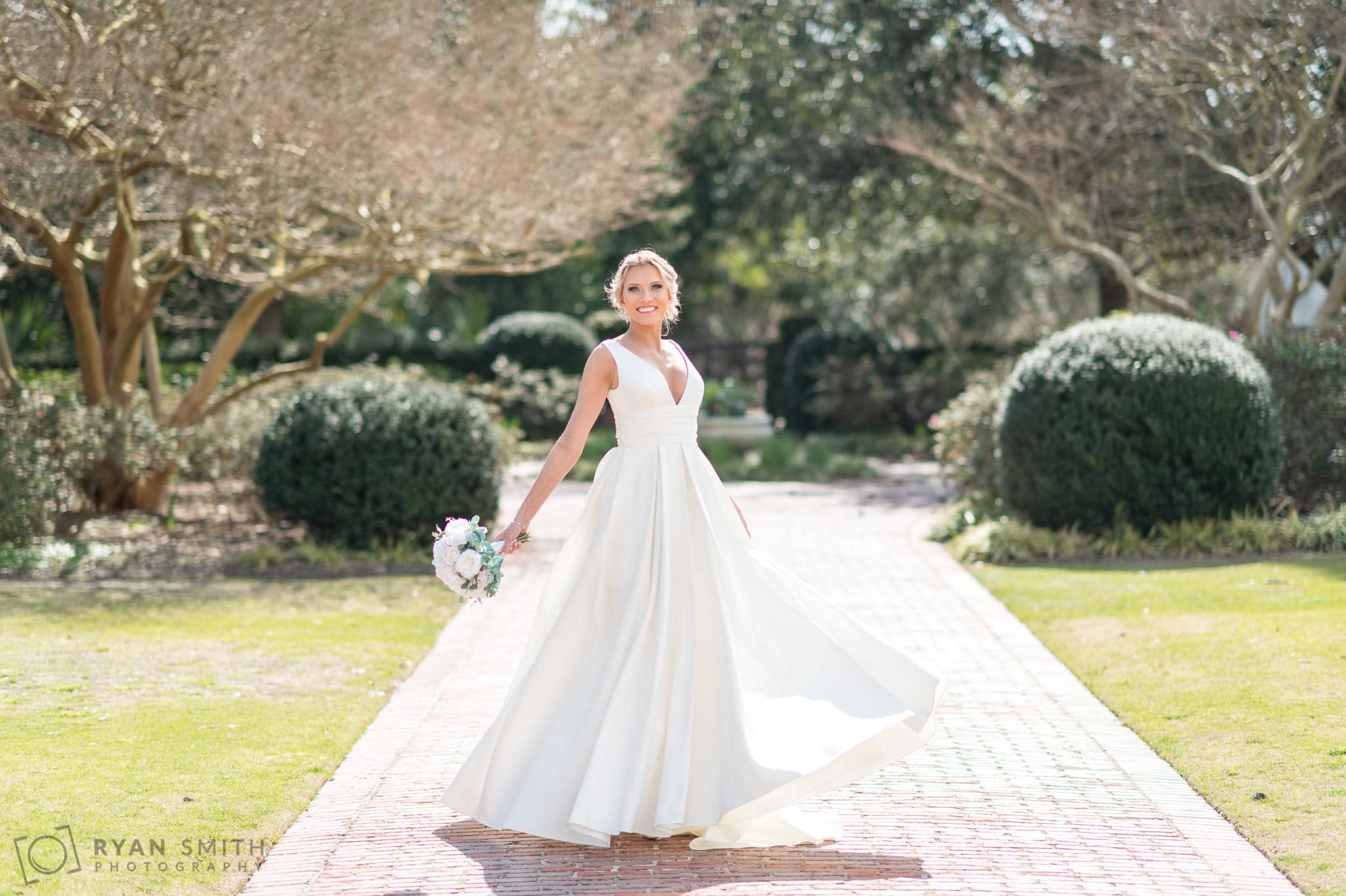 Bride spinning around in her wedding dress - Pine Lakes Country Club