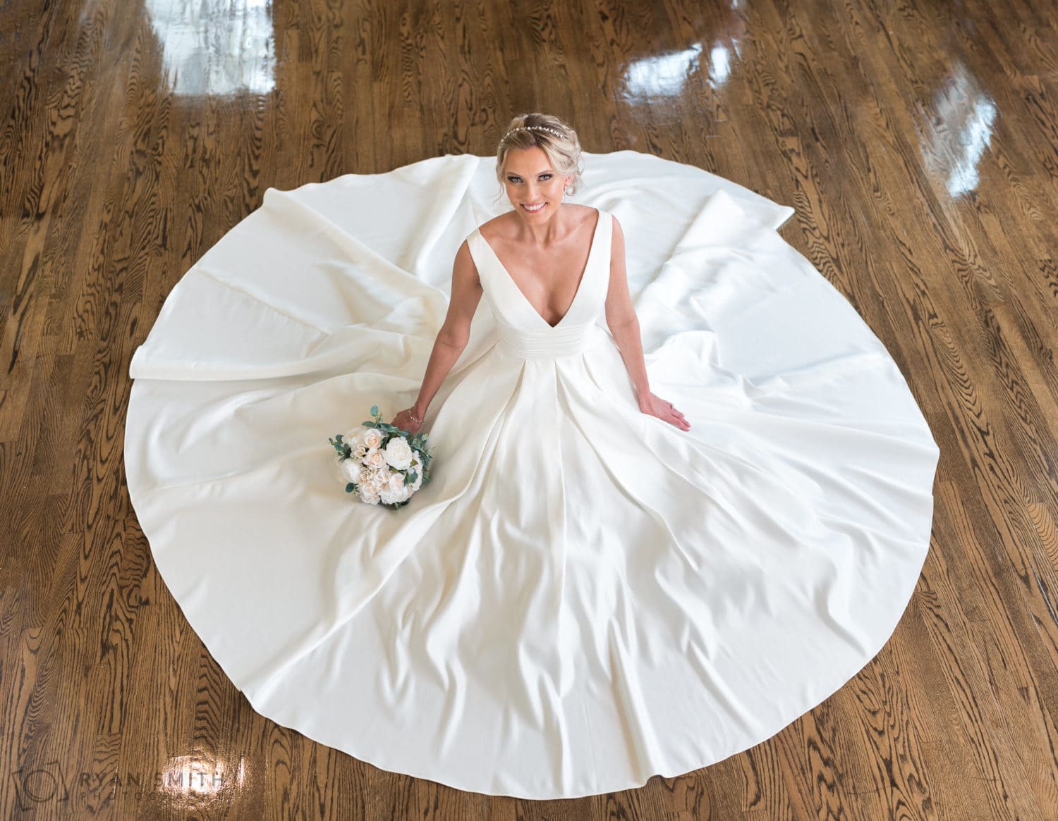 Bride with dress flowing around her looking up - Pine Lakes Country Club