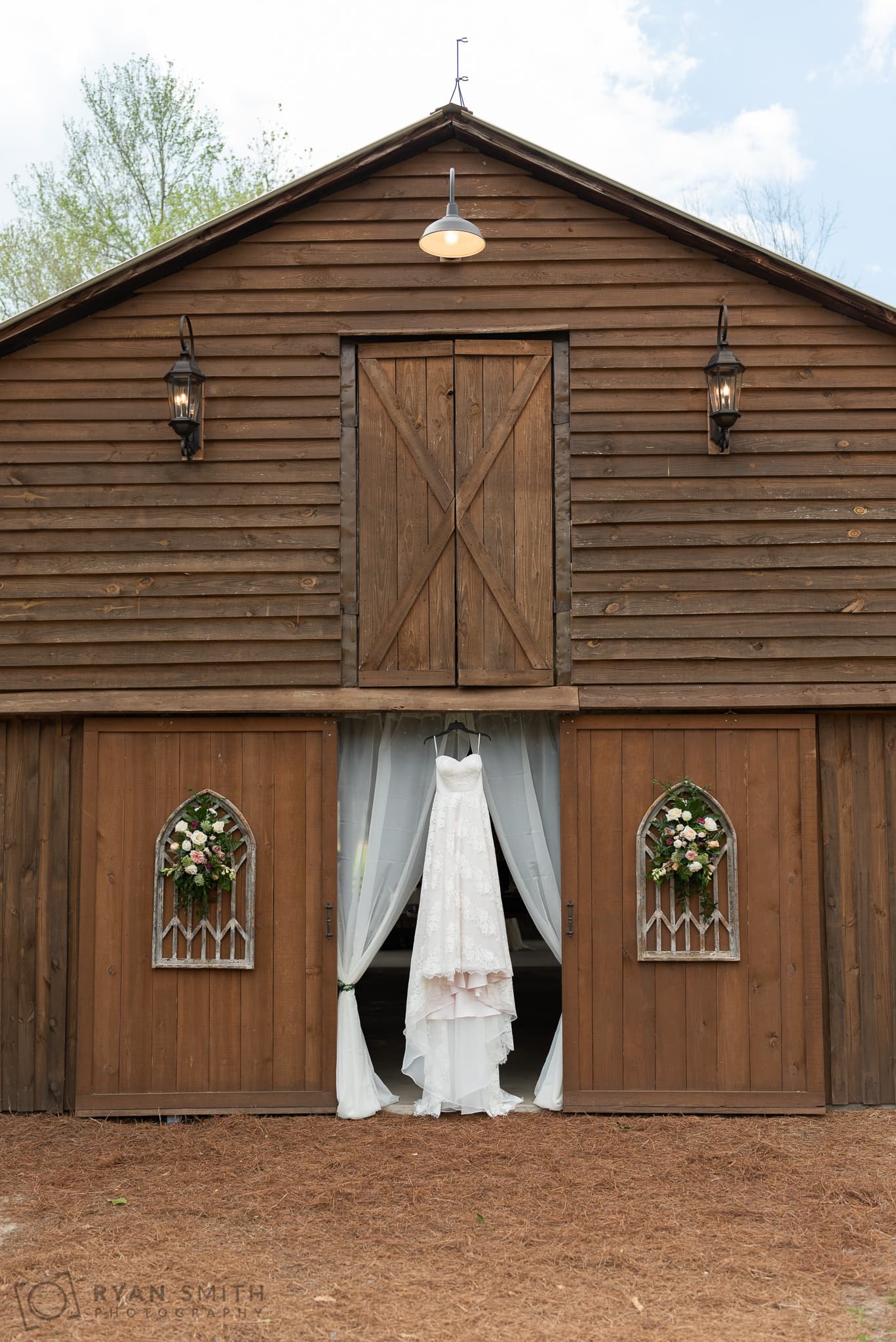 Dress hanging in the barn doorway - Wildhorse at Parker Farms
