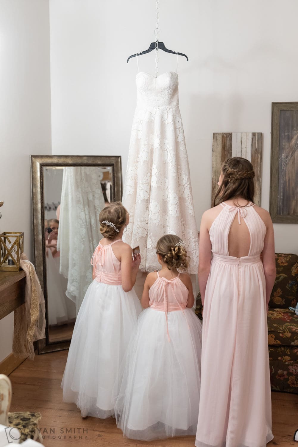 Flowergirls looking at bride's dress - Wildhorse at Parker Farms