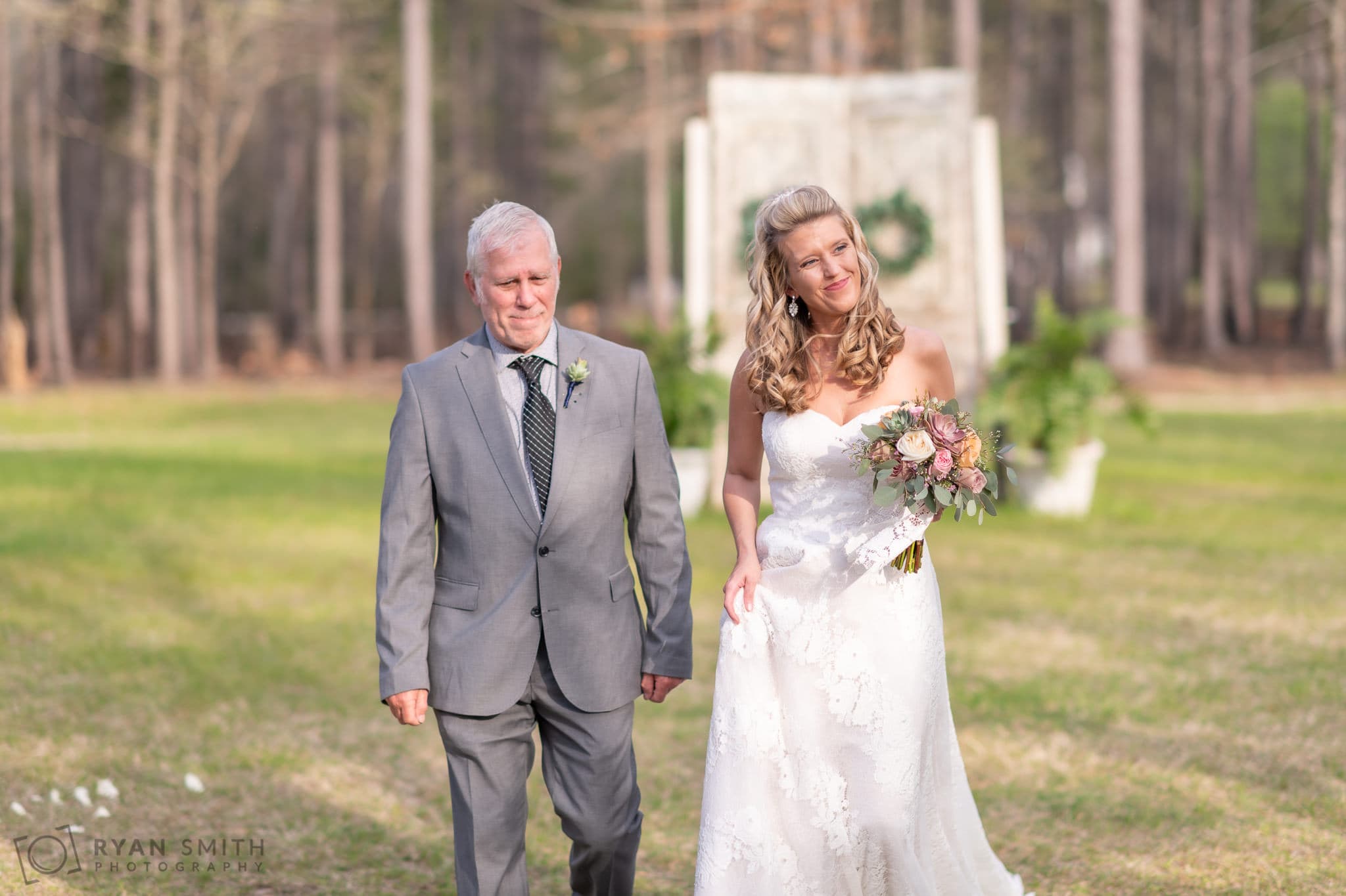 Happy bride and father walking to the ceremony - Wildhorse at Parker Farms