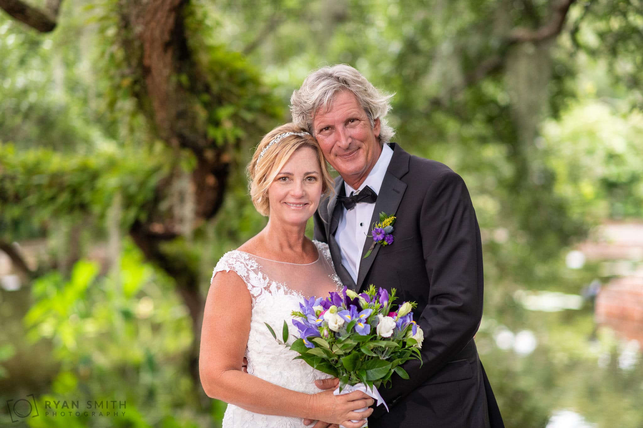 Bride and groom portrait under the moss covered trees - Diana of the Chase Pool - Brookgreen Gardens