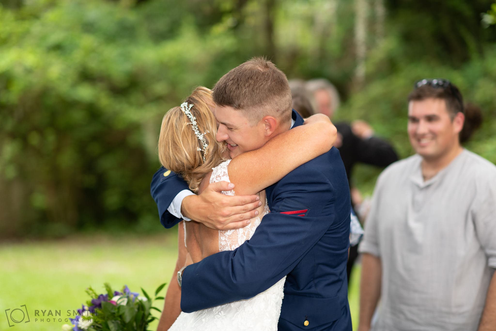Bride hugging son after ceremony - Holiday Cottage - Brookgreen Gardens