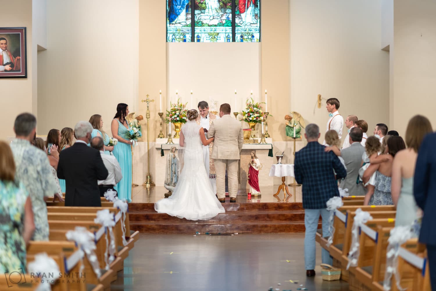 Bride and groom during the wedding ceremony - St. Michael's - Garden City, SC