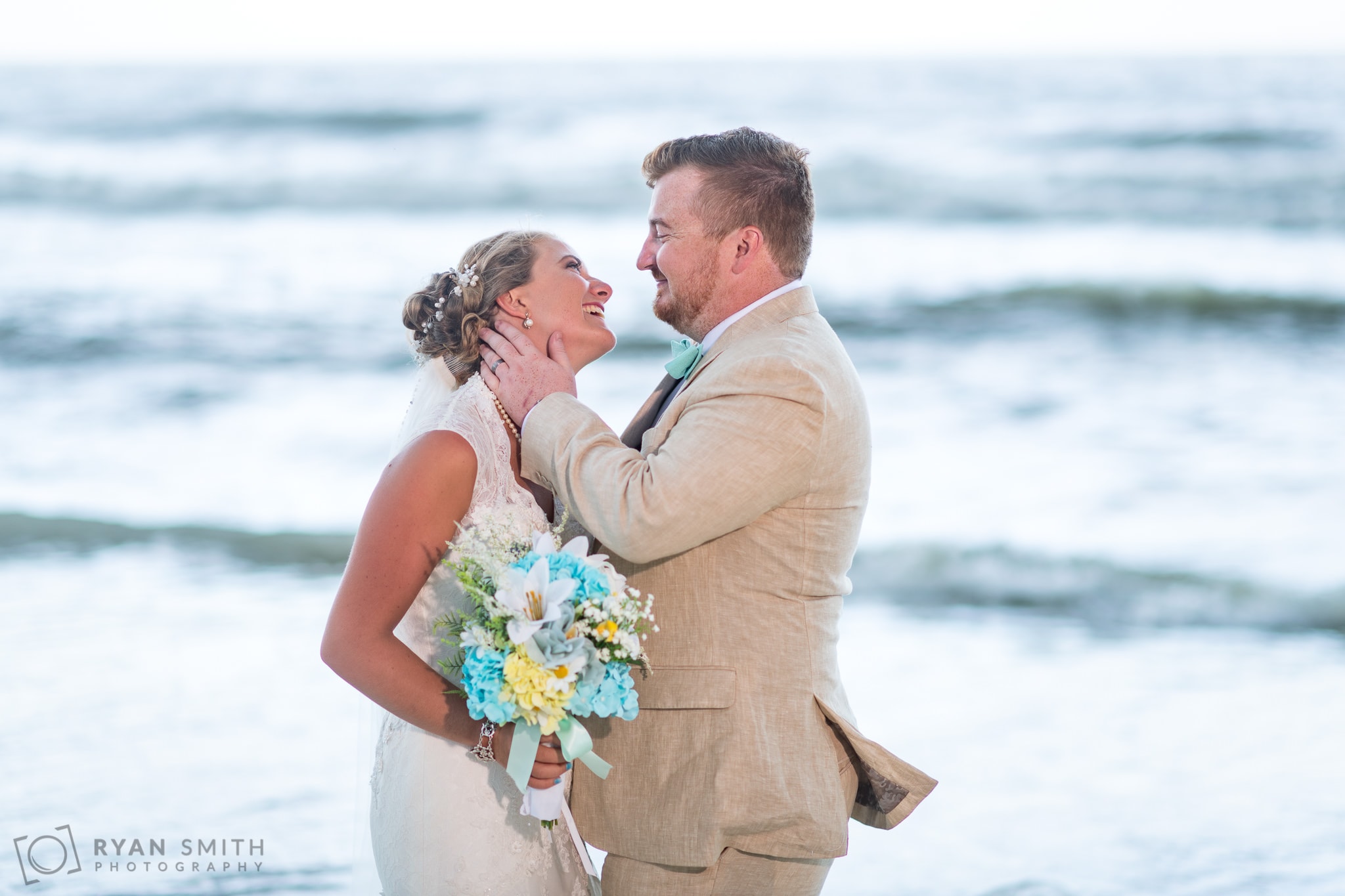 Bride and groom in front of the ocean - Atalaya Castle - Huntington Beach State Park
