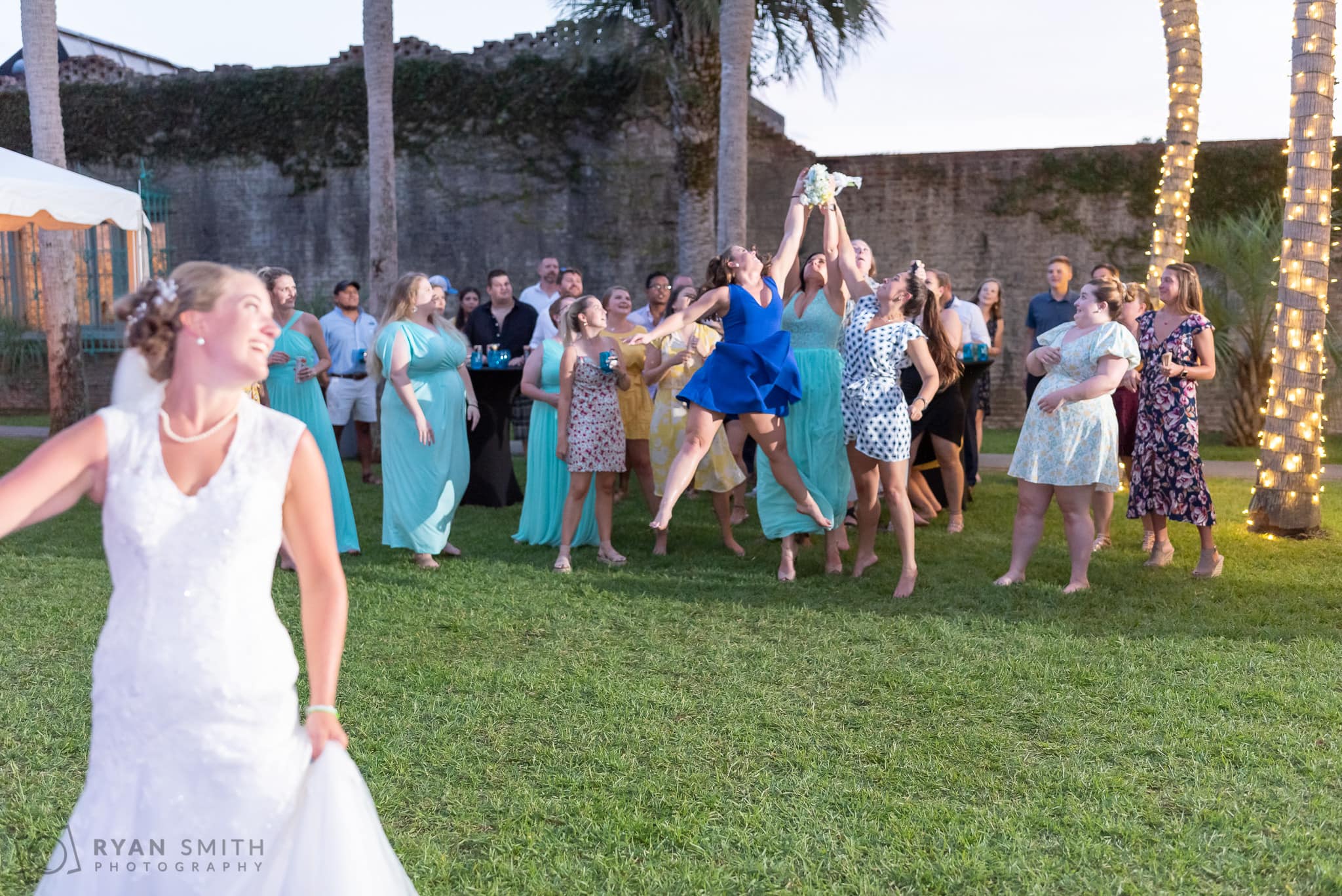Bridesmaids fighting for the bouquet  - Atalaya Castle - Huntington Beach State Park