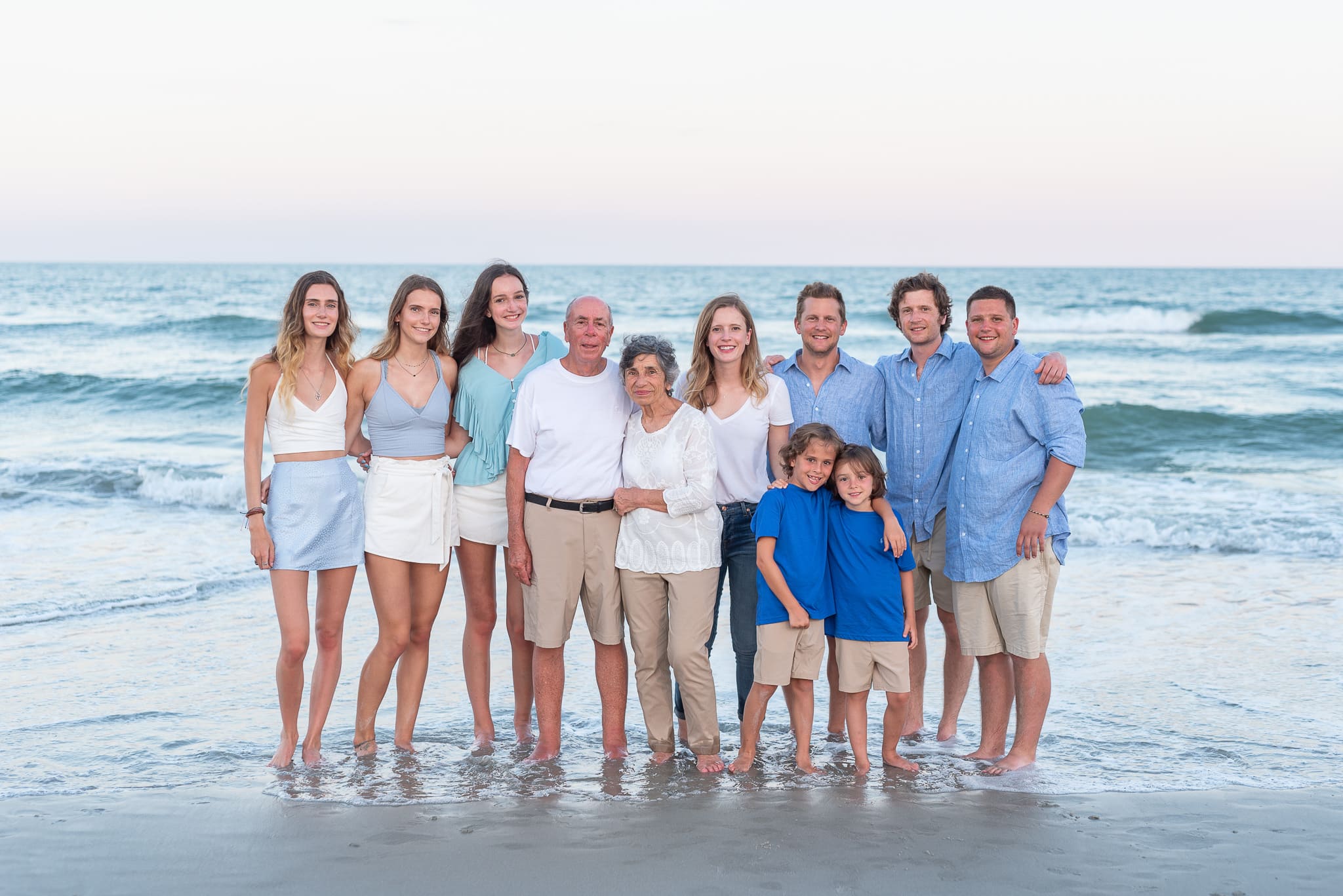 Large family standing in front of the ocean - Huntington Beach State Park