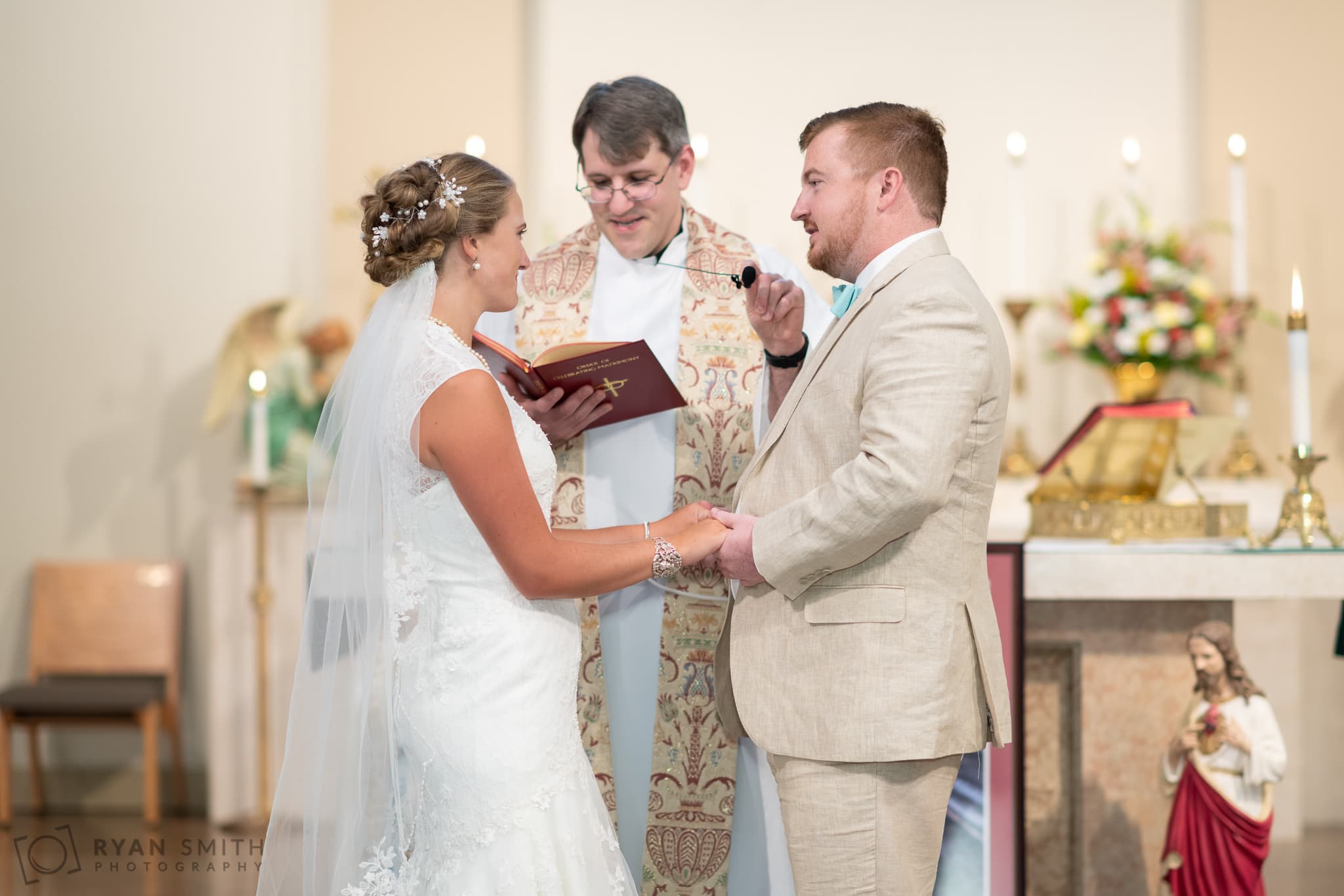 Groom giving vows to the bride - St. Michael's - Garden City, SC