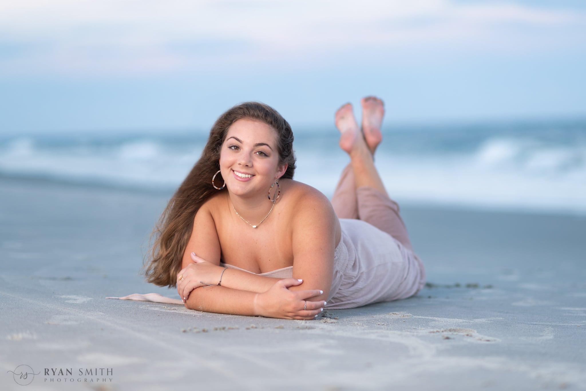 Senior girl portrait laying in the sand - Huntington Beach State Park