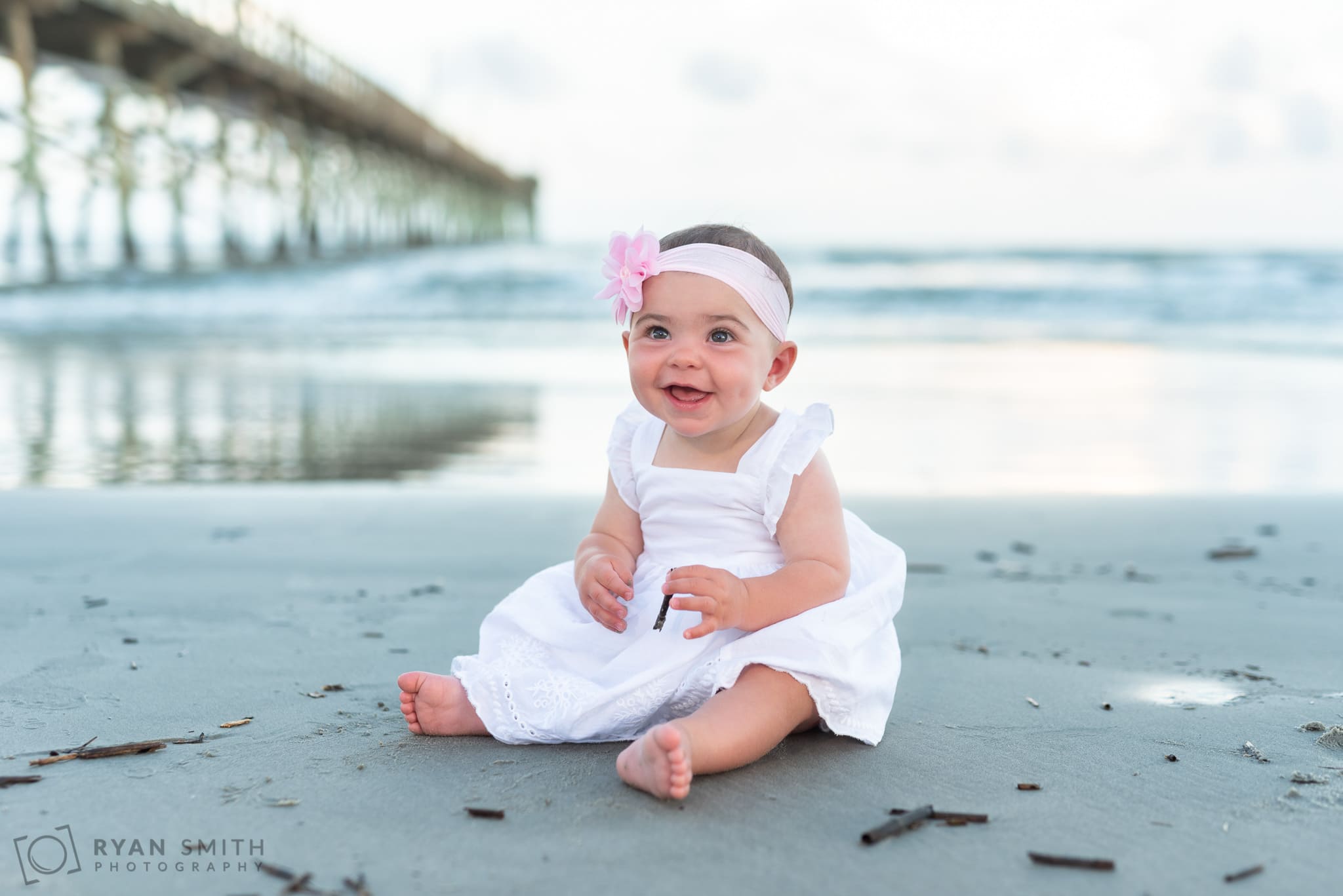 Baby girl sitting by the pier  - Ocean Isle