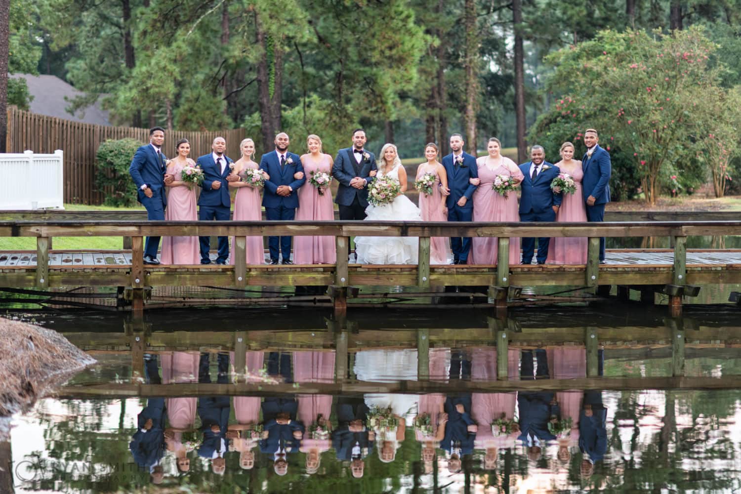 Bridal party on the bridge reflecting in the water - Litchfield Country Club