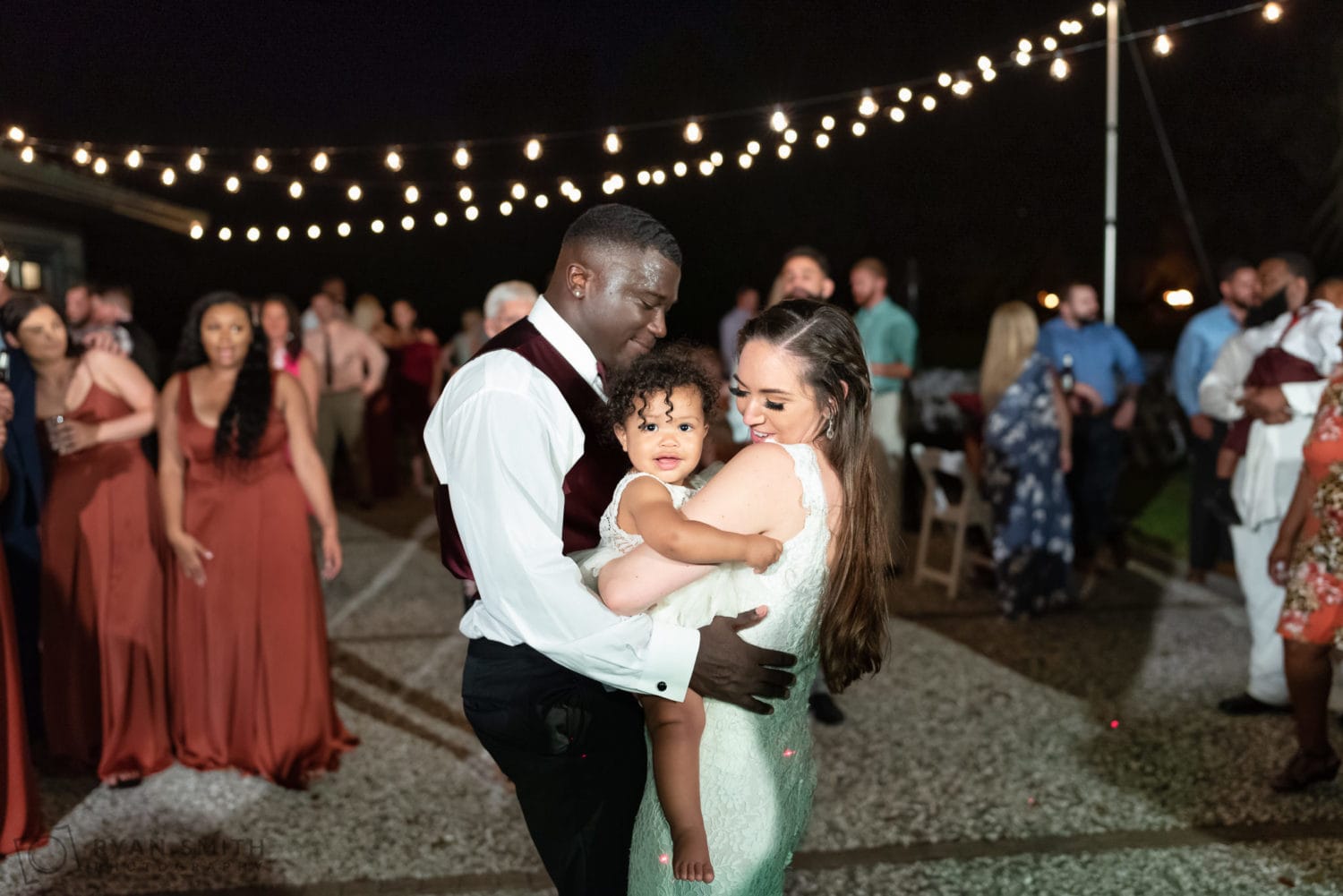 Bride and groom dancing with baby girl - Magnolia Plantation - Charleston, SC