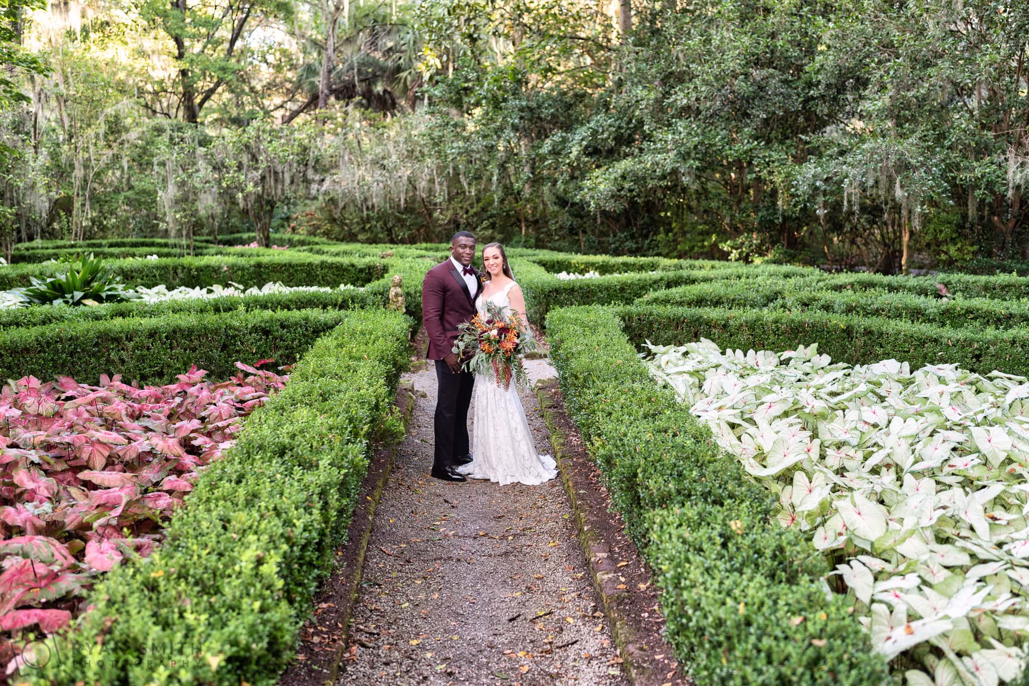 Bride and groom on the garden path - Magnolia Plantation - Charleston, SC