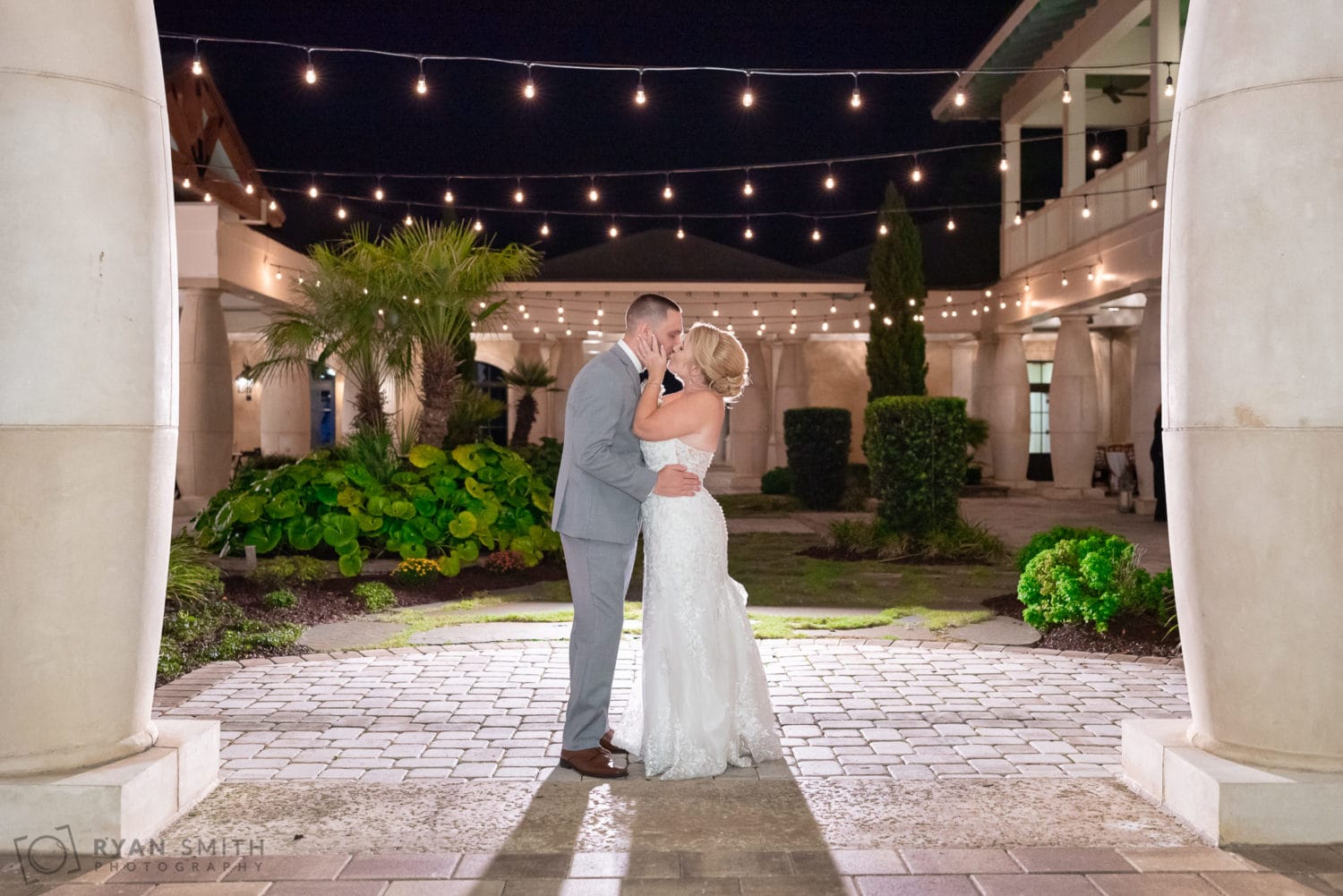 Bride and groom under the lights in the courtyard - 21 Main Events - North Myrtle Beach