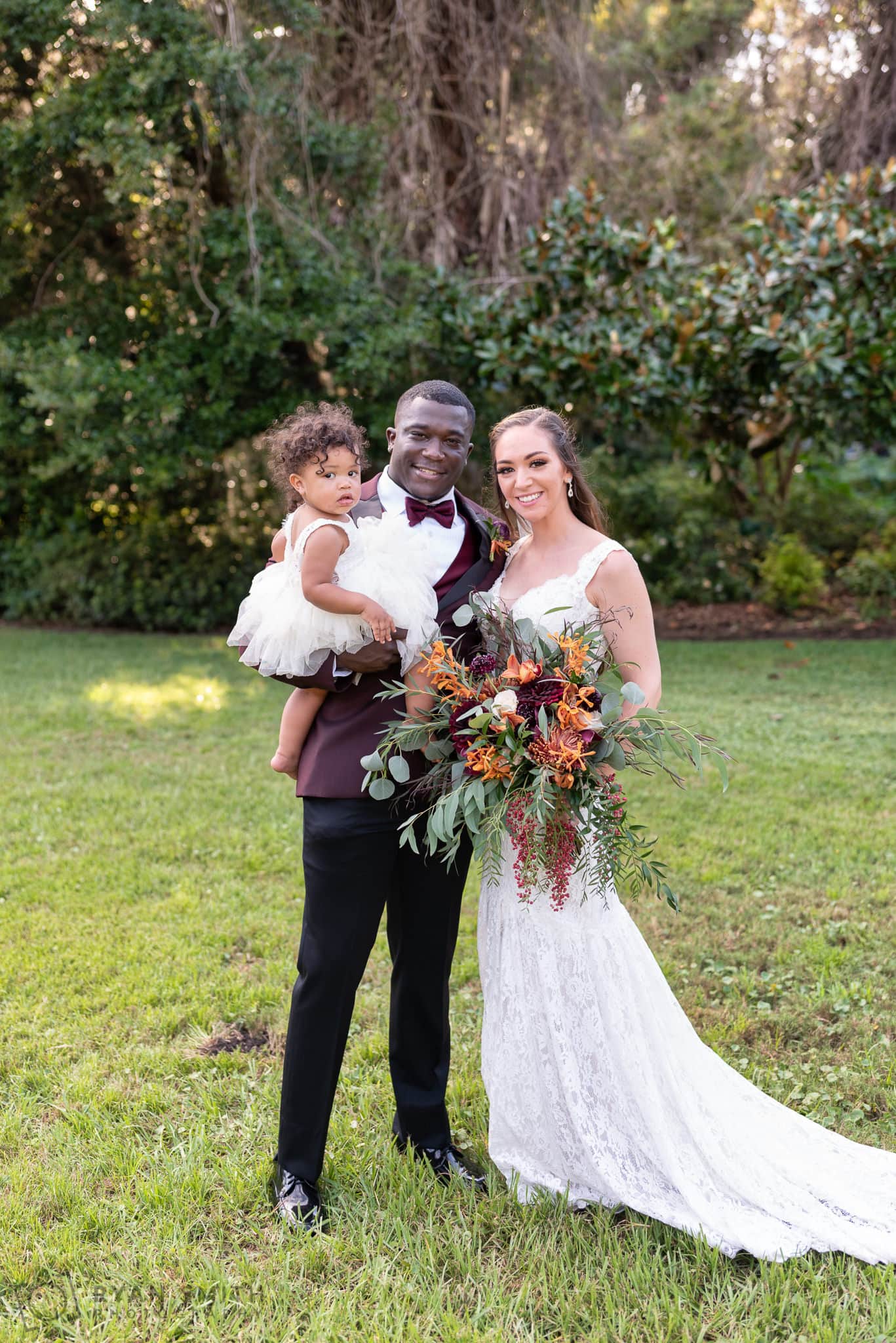 Bride and groom with daughter  - Magnolia Plantation - Charleston, SC