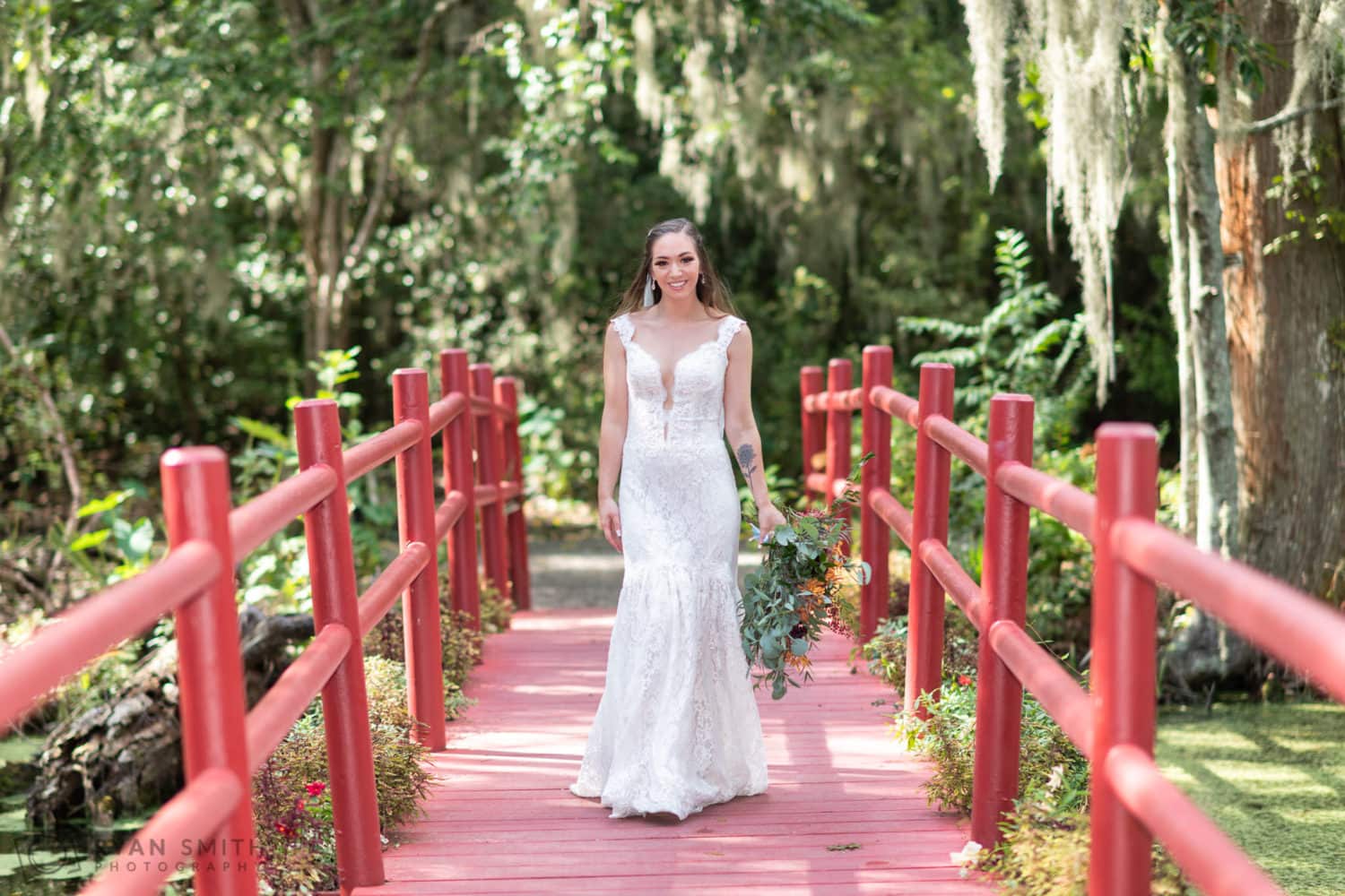 Bride walking down the red bridge - Magnolia Plantation - Charleston, SC