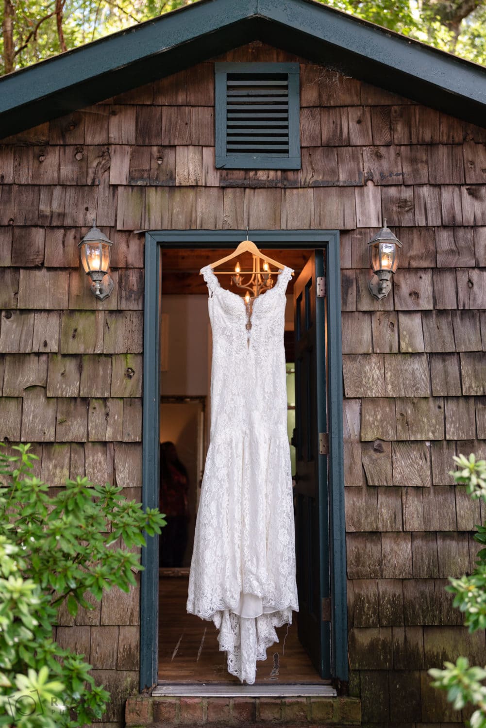 Brides dress having in doorway - Magnolia Plantation - Charleston, SC
