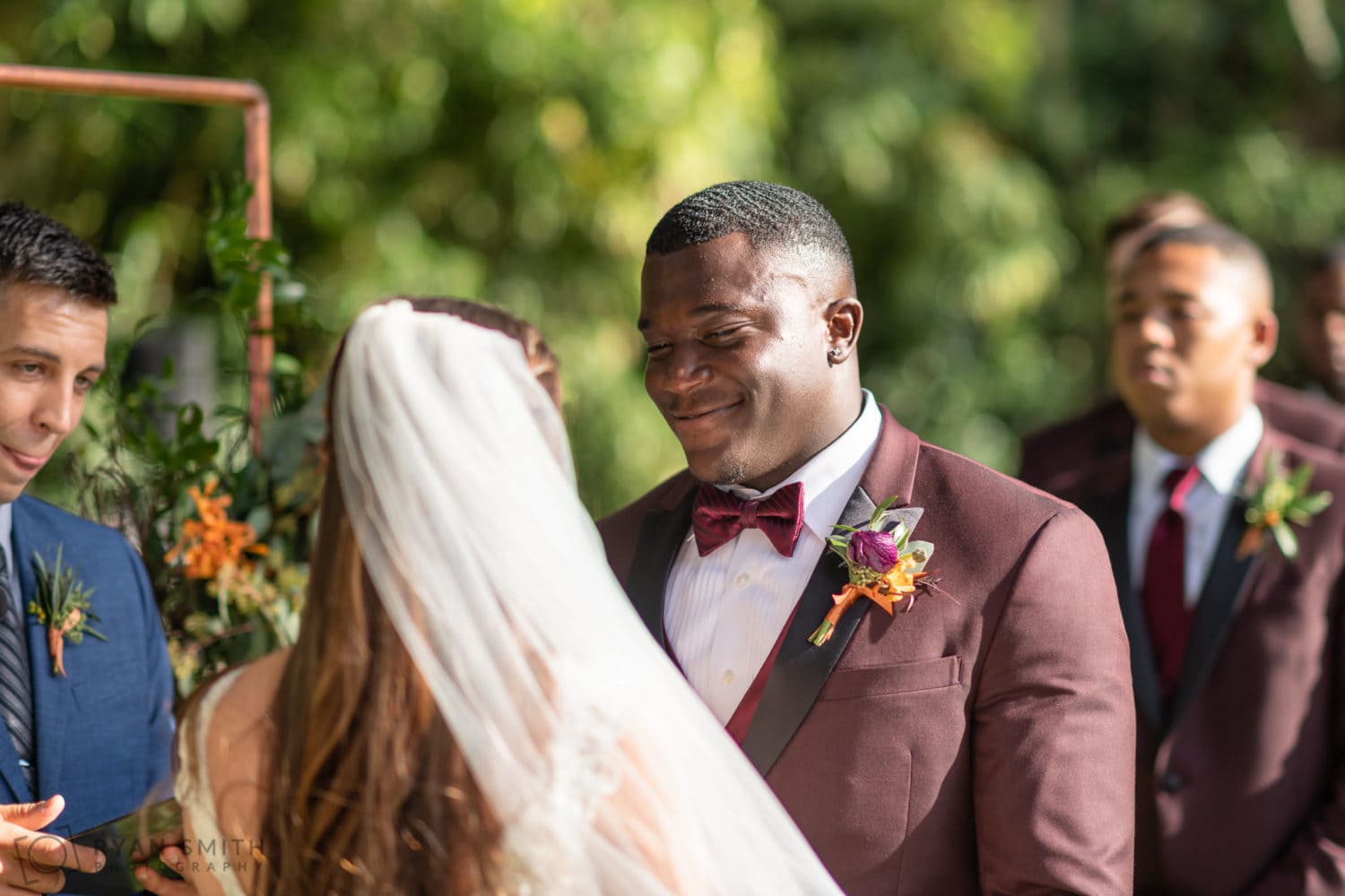 Groom smiling at bride during vows - Magnolia Plantation - Charleston, SC