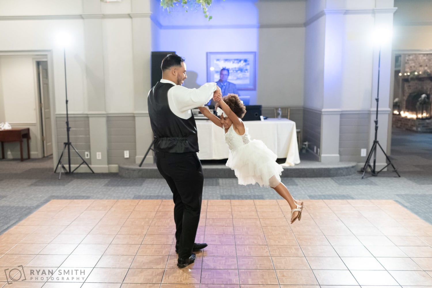 Groom spinning flower girl on the dance floor - Litchfield Country Club