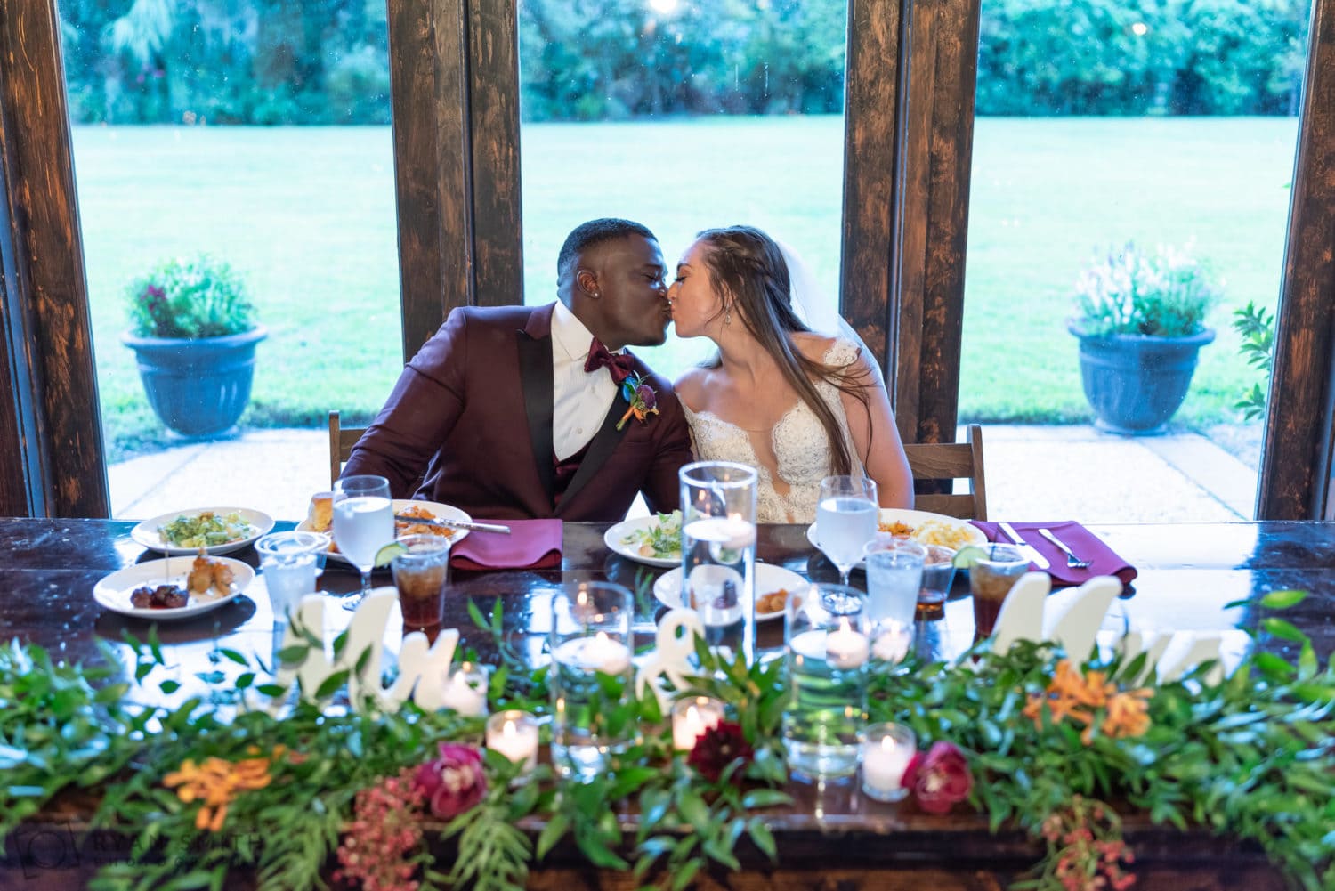 Kiss at the sweetheart table - Magnolia Plantation - Charleston, SC