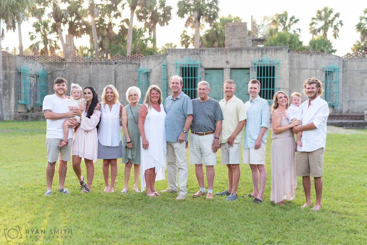 Large family standing behind the Atalaya Castle - Huntington Beach State Park