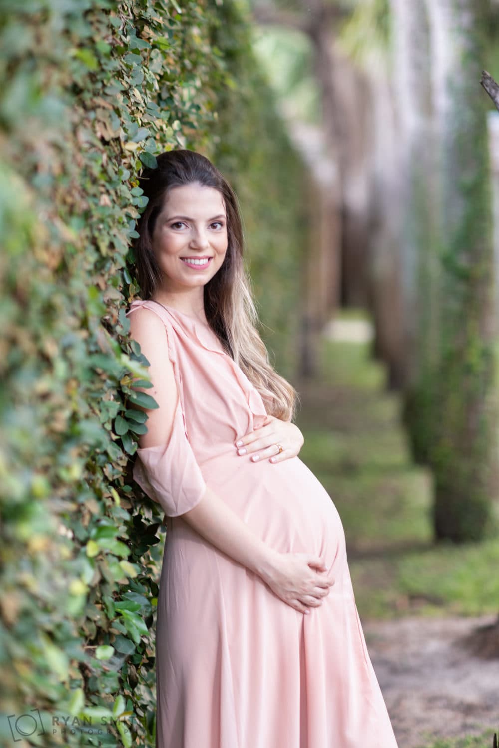 Maternity portraits leaning against the ivy wall - Atalaya Castle