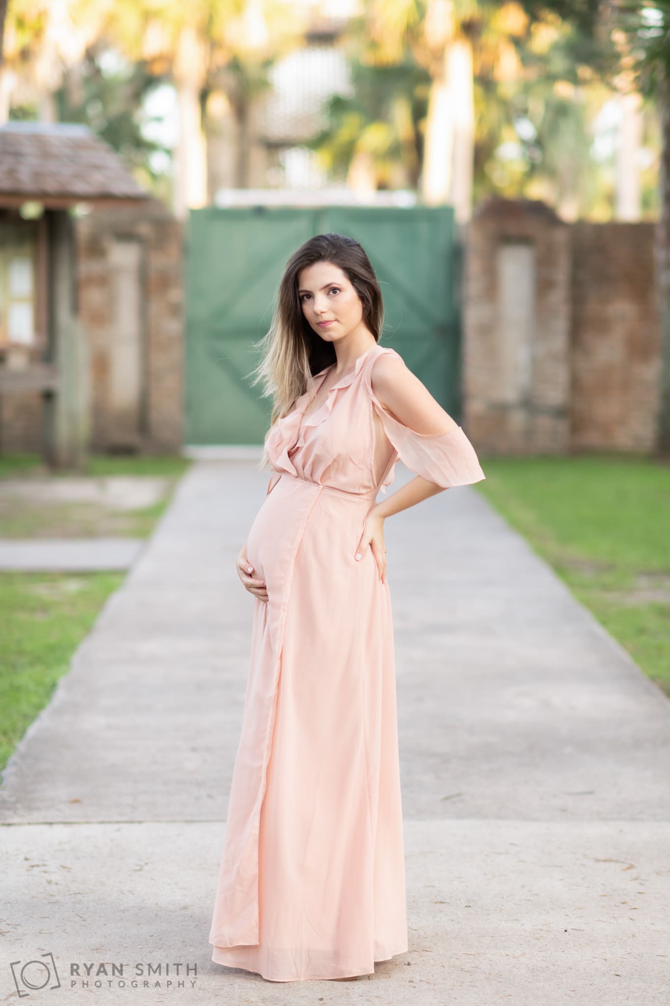 Maternity portrait with mother touching her belly  - Atalaya Castle