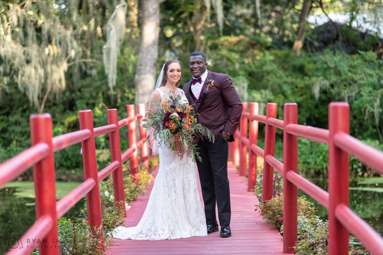 Portraits of bride and groom on the red bridge - Magnolia Plantation - Charleston, SC