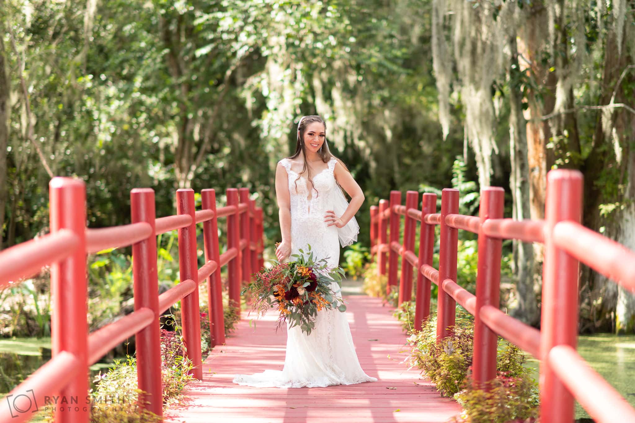 Portraits of bride on the red bridge - Magnolia Plantation - Charleston, SC