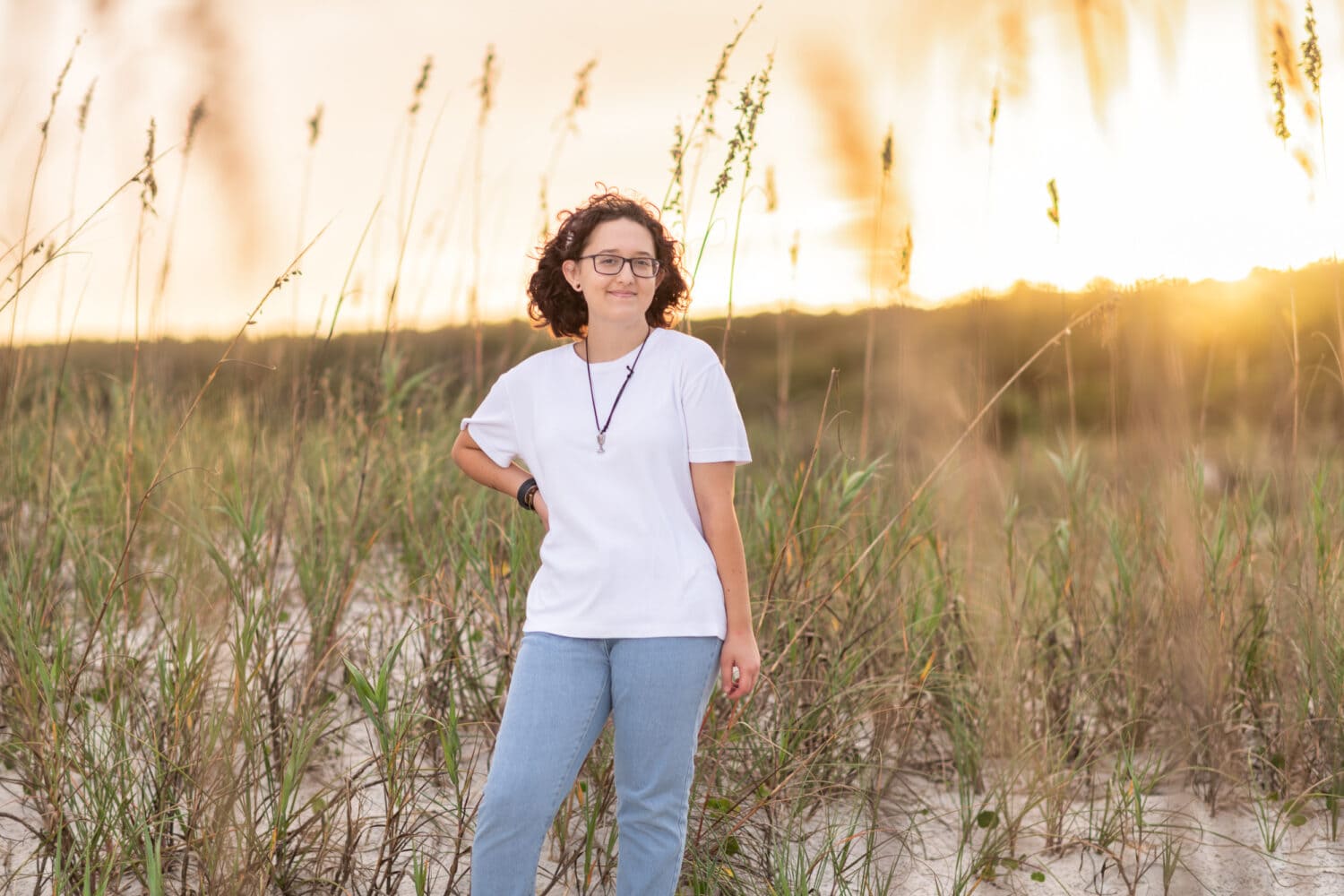 Senior portraits by the ocean and Atalaya Castle for an artist with her canvas and paints - Huntington Beach State Park