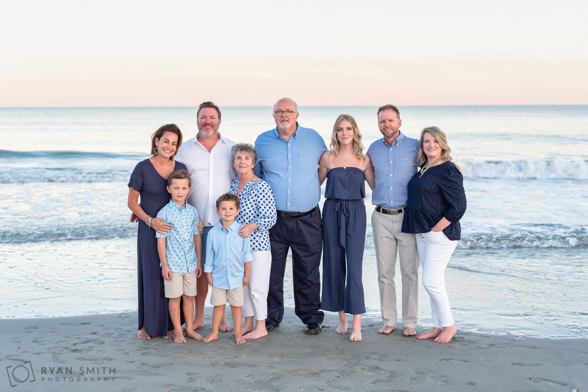 Two families with grandparents in front of the ocean - Huntington Beach State Park