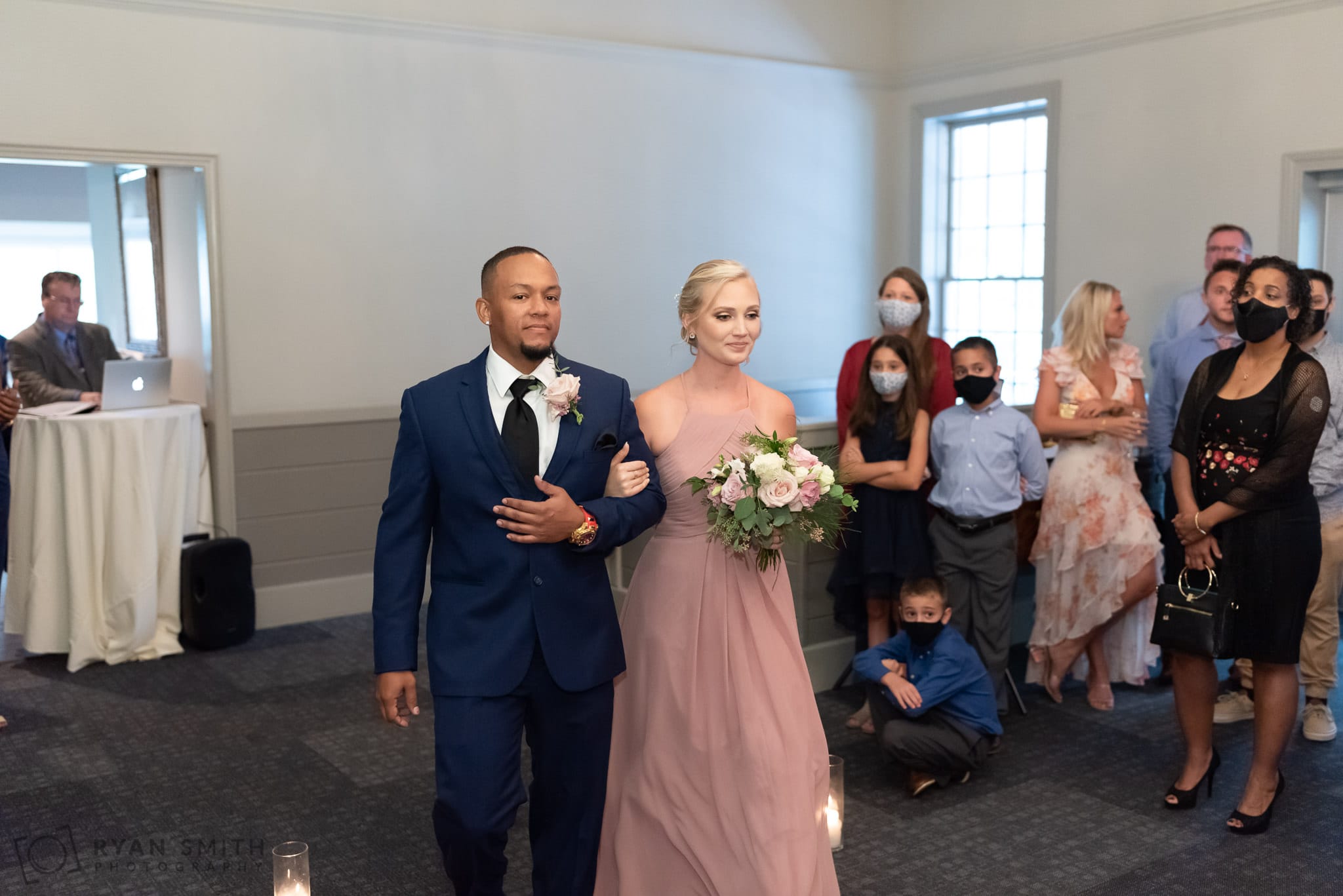Walking down the isle of the indoor ceremony - Litchfield Country Club
