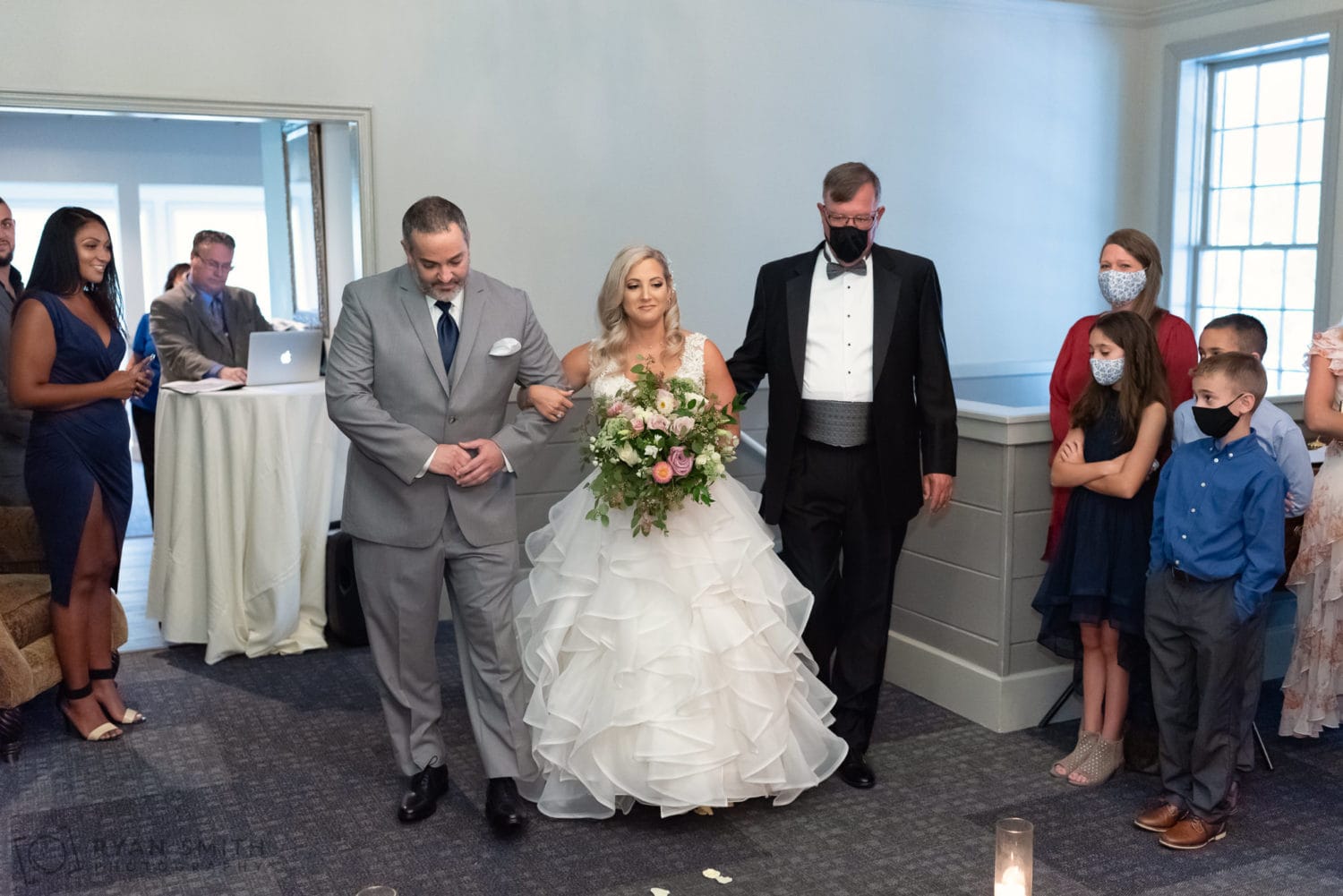 Walking down the isle of the indoor ceremony - Litchfield Country Club