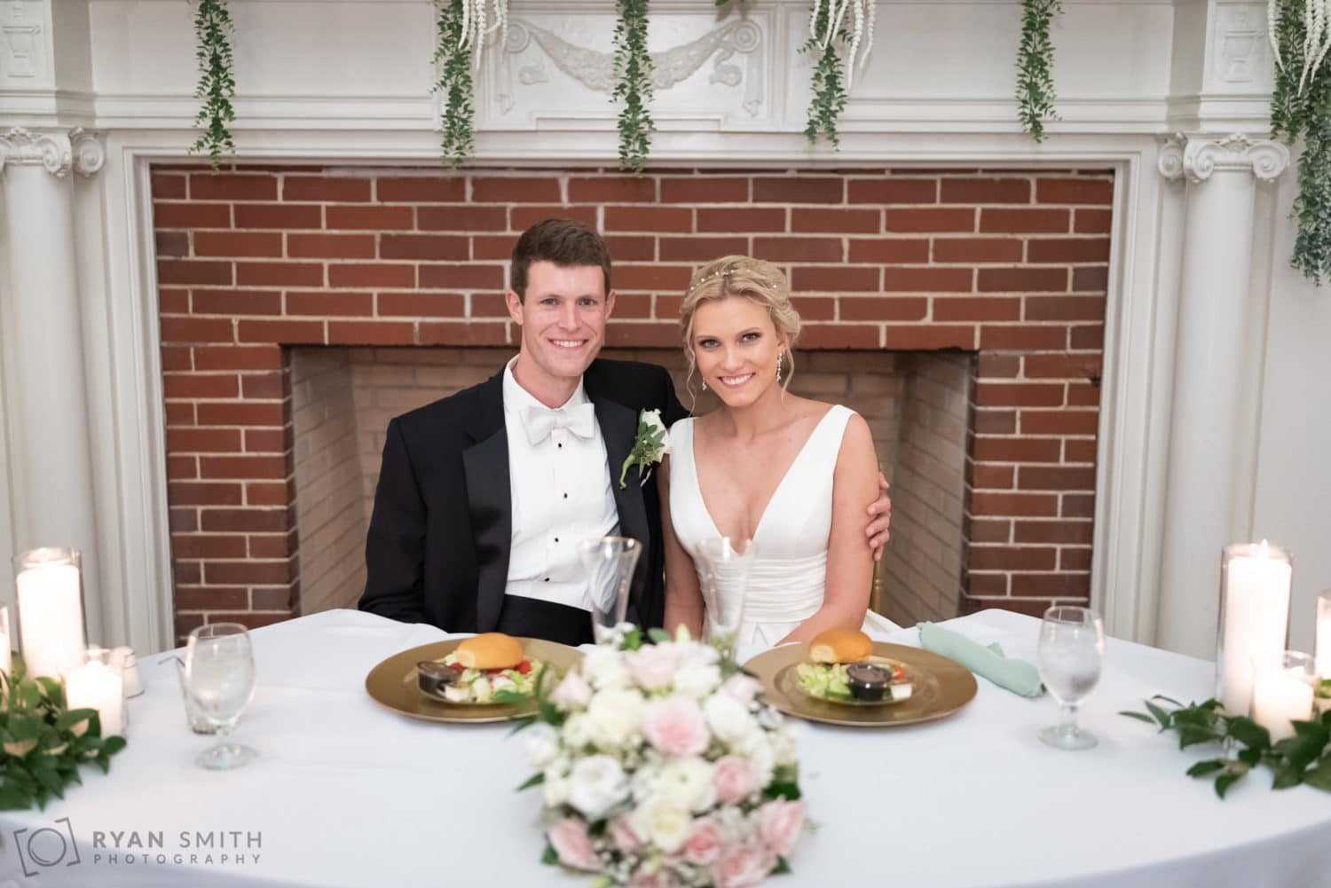 Bride and groom at the sweetheart table - Pine Lakes Country Club