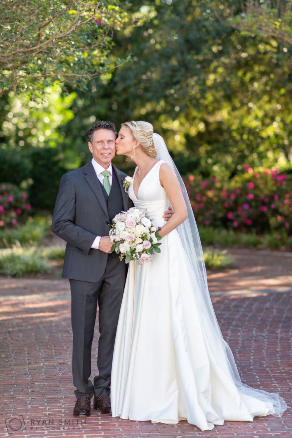 Bride kissing father on her cheek  - Pine Lakes Country Club