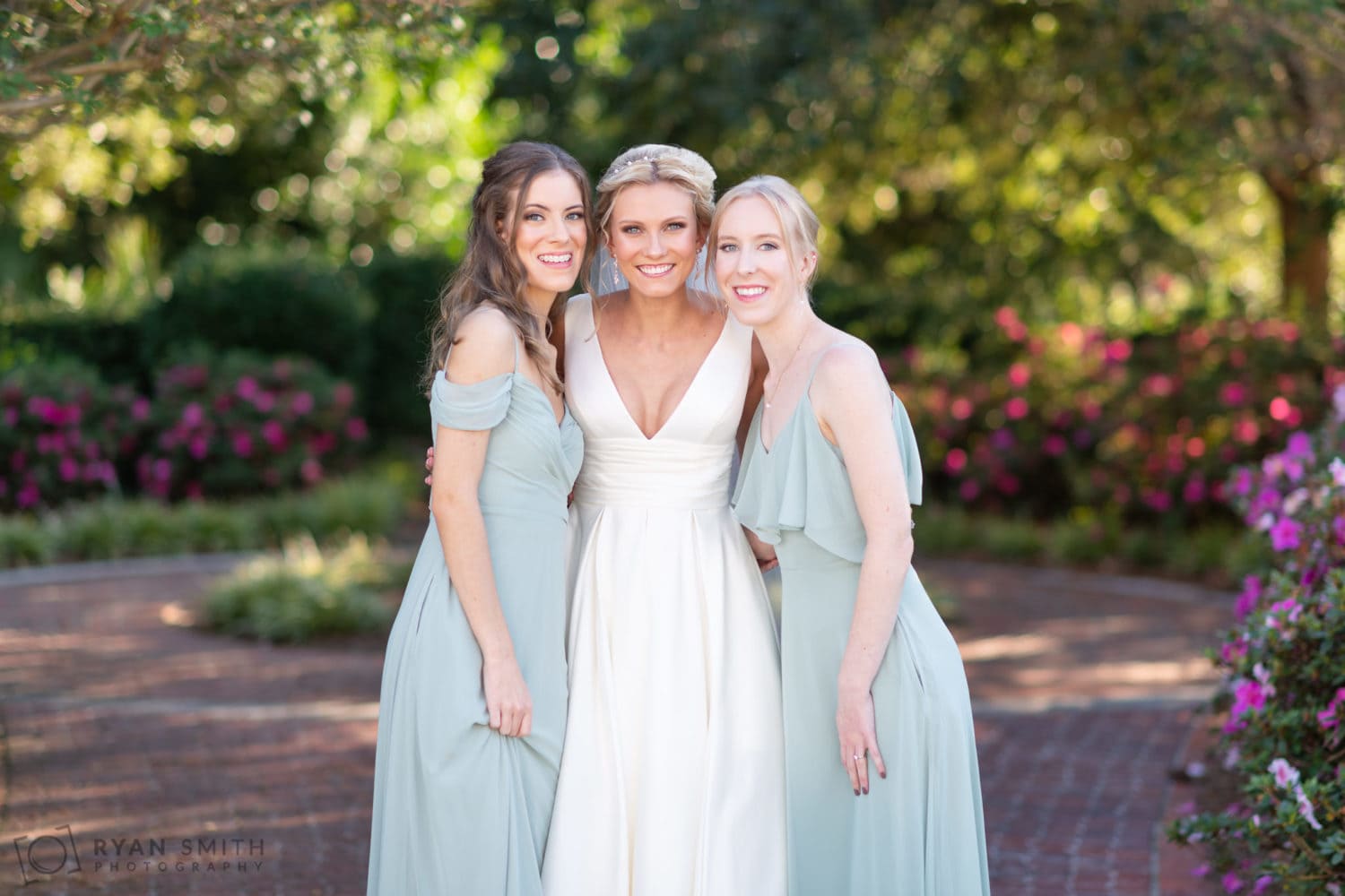 Bride with her sisters in the garden - Pine Lakes Country Club