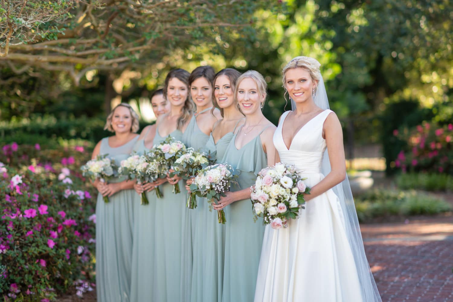 Fun poses with the bride and bridesmaids in the garden - Pine Lakes Country Club
